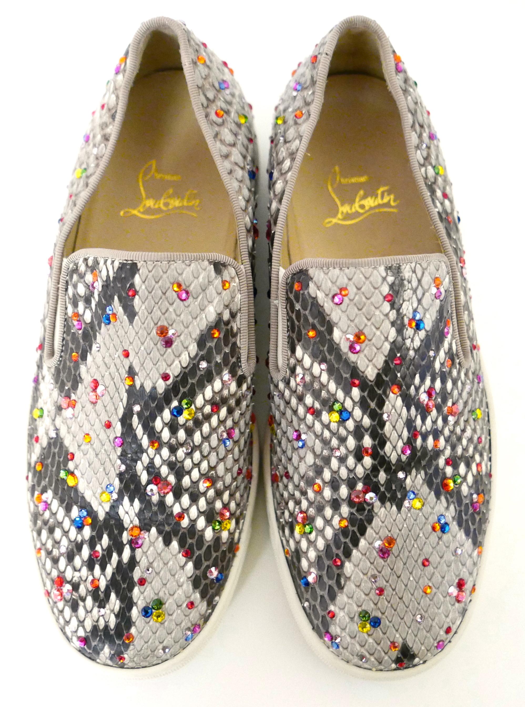 Stunning Christian Louboutin Roller Boat sneakers - bought for $2100 and worn once. Come with single dustbag.

Made from beautifully snake leather which is dusted with a rainbow of sparkling different sized crystals. They have 
thick off white and