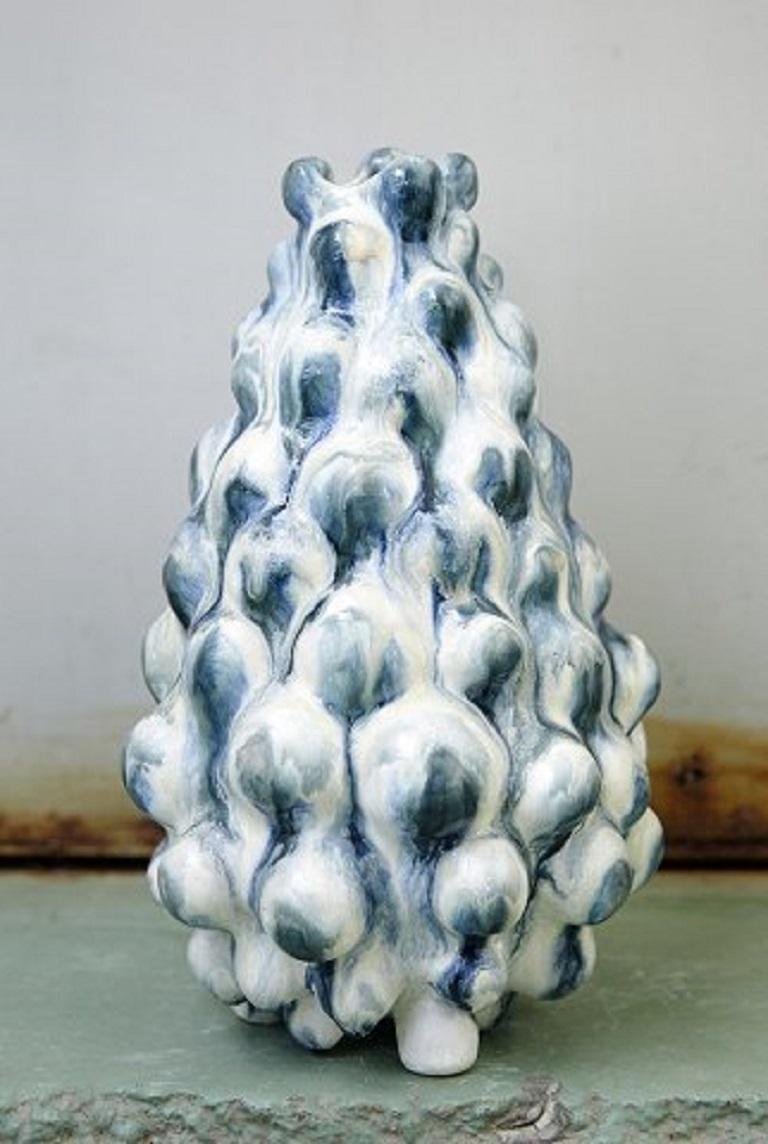 Christina Muff, Danish contemporary ceramicist (b. 1971). 
Sculptural vase, hand modelled in stoneware clay. This vase has a beautiful blue and white glaze that runs and mixes. Part of the Salt series by Christina Muff. One of a kind.
Signed by