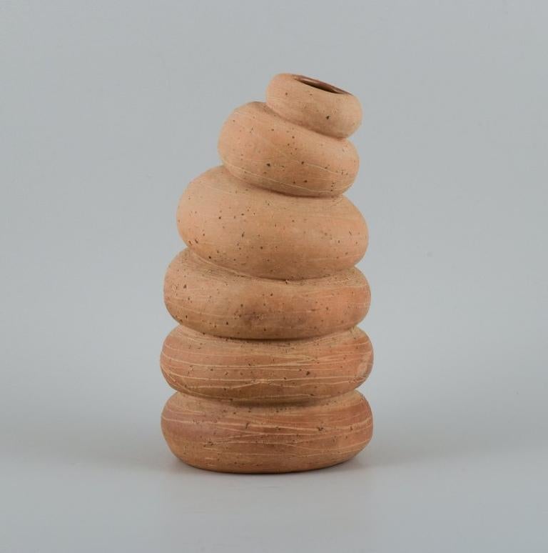 Christina Muff, contemporary Danish ceramicist (b. 1971). 
Tall, organically shaped vessel made from stoneware clay. The sculpture is one of a kind.
In excellent condition.
Signed.
Dimensions: W 14.0 cm. x H 24.0 cm.

Technique - Christina Muff’s