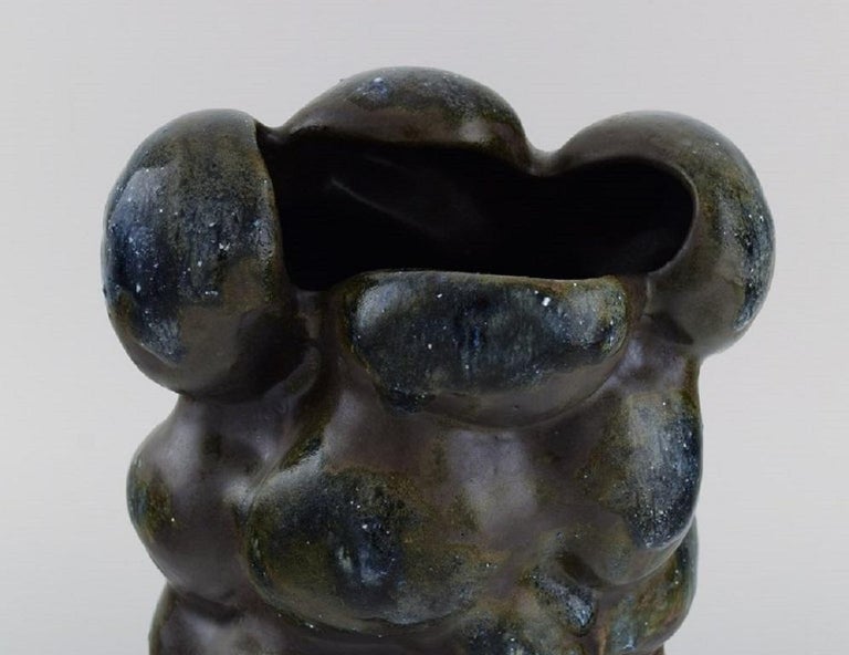 Christina Muff, Danish contemporary ceramicist (b. 1971). 
Large sculptural unique vase in glazed stoneware. Beautiful brown-black matte glaze with blue tops and white minerals.
Measures: 28 x 20 cm.
In excellent condition.
Signed.

Technique