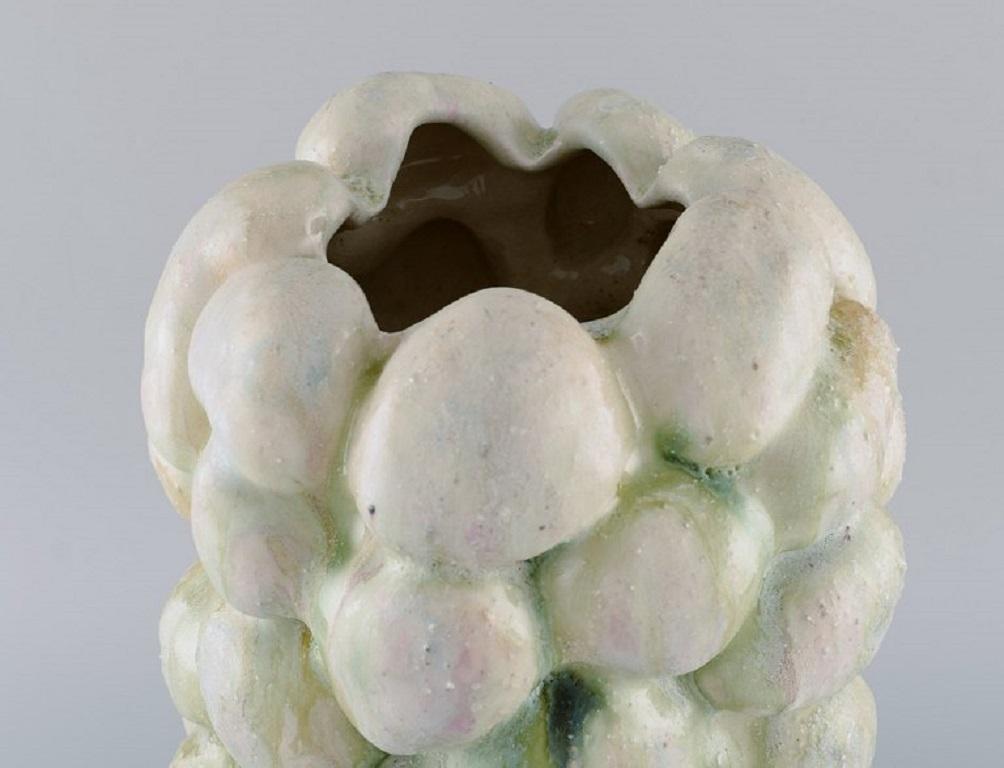 Christina Muff, Danish contemporary ceramicist (b. 1971). 
Large sculptural unique vase in glazed stoneware. Beautiful cream glaze with minerals from Danish beaches.
Measures: 36.5 x 23 cm.
In excellent condition.
Signed.

Technique -