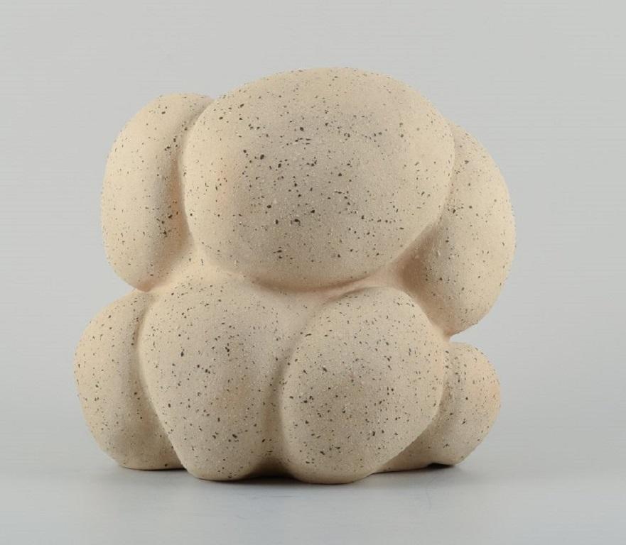 Christina Muff, Danish contemporary ceramicist (b. 1971). 
Large, unglazed unique vessel. Large bulging protrusions emphasize the organic shape. The stoneware clay used for this work has a creamy color with black and white specs in different sizes