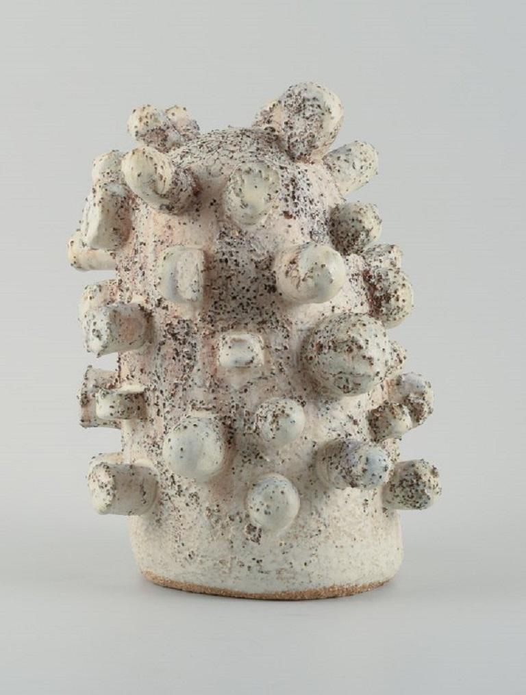 Christina Muff, Danish contemporary ceramicist (b. 1971). 
Large unique stoneware sculpture in off-white glaze with iron-covered specks.
Measuring: W 23 x H 29 cm.
In excellent condition.
Signed.

Technique - Christina Muff’s forms are modelled by