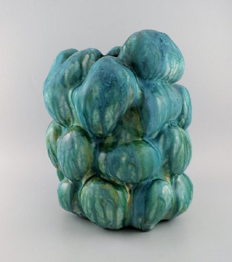 Christina Muff, Danish contemporary ceramicist (b. 1971). 
Monumental unique stoneware vase with turquoise and green glazes.
Measures: 38 x 35 cm.
In excellent condition.
Signed.

Technique - Christina Muff’s forms are modelled by hand using