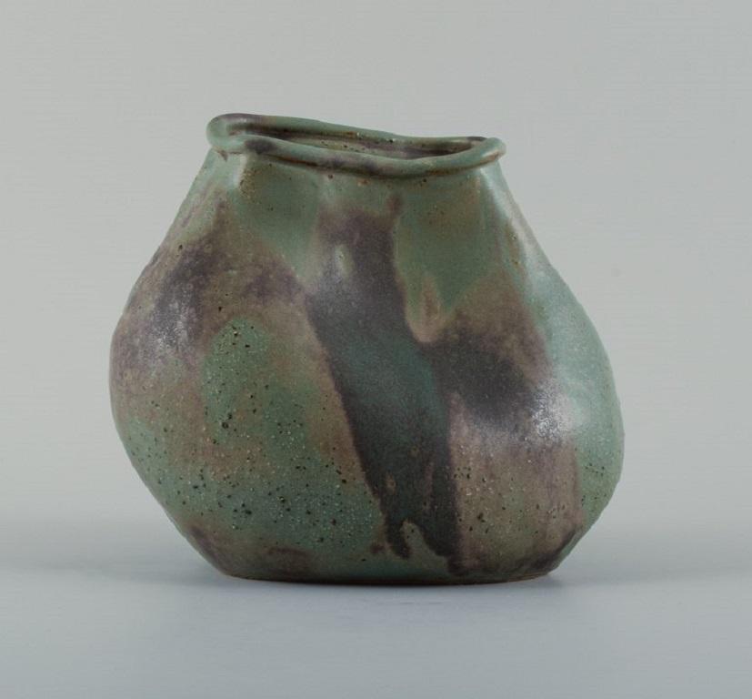 Christina Muff, Danish contemporary ceramicist (b. 1971). 
Unique seedpod vessel made from stoneware clay, with matte blue and brown glaze.
Measuring: W 18 x H 19 cm.
In excellent condition.
Signed.

Technique - Christina Muff’s forms are