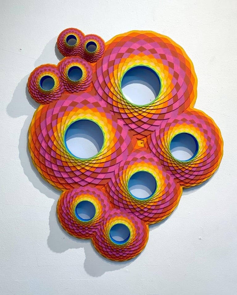 Acrylic on Lasercut Wood by Christine Romanell. 
Pink, orange and yellow swirls in geometric pattern with blue and green interior. 
Original signed by the artist on verso.  Comes ready to hang.

ARTIST BIO 
Christine Romanell’s colorful wall