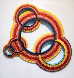 Ripple, multi-color circular wood wall sculpture by Christine Romanell