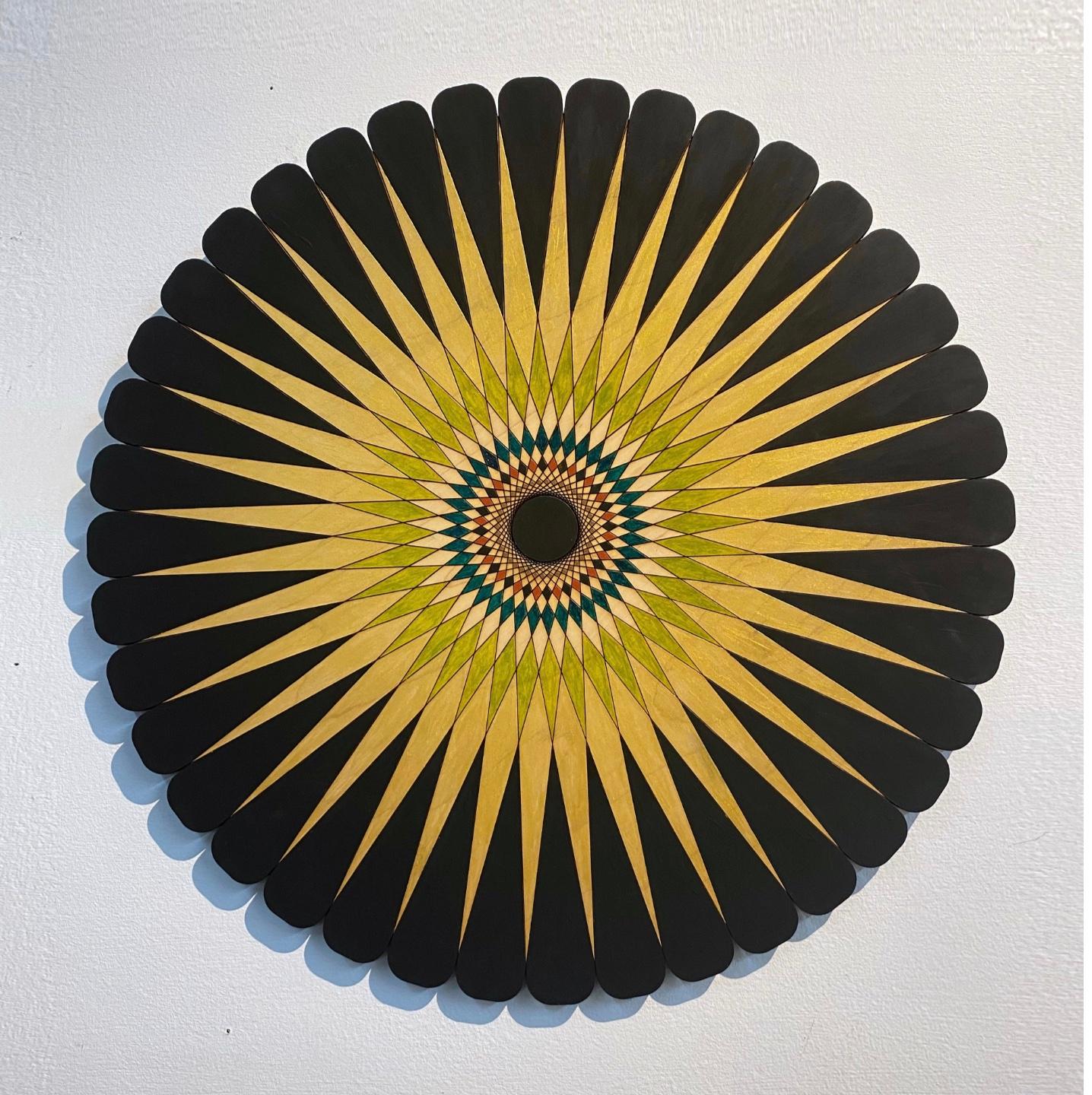 Starburst 5, golden geometrical circular painting, Acrylic on Wood, Signed by artist.

ARTIST BIO
Christine Romanell’s colorful wall sculptures and installations explore non-repeating patterns informed by cosmology and physics, while rooting itself