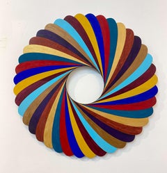 Stripe Twist, color acrylic, circular wood wall sculpture, Christine Romanell