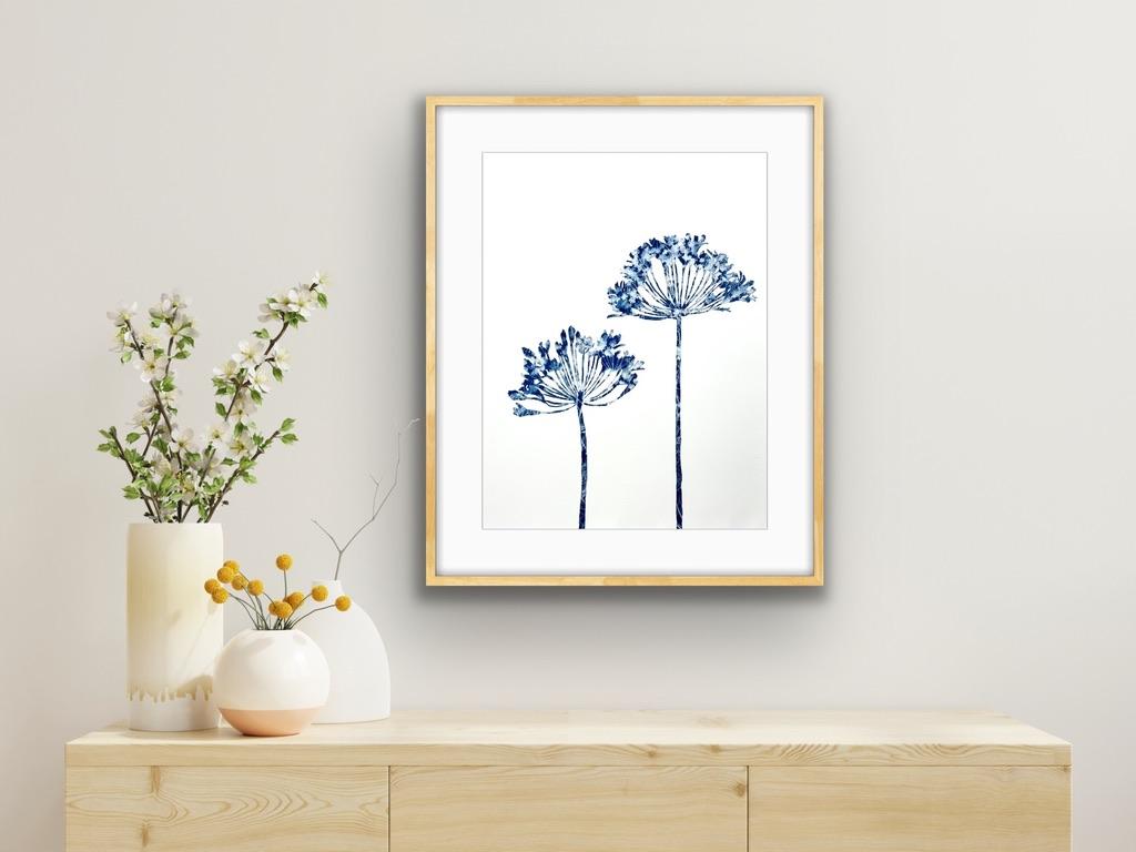 This is a combination of painting and photography, the antique cyanotype process. The silhouette of the plant was first drawn, then painted not with ink or paint, but with light-sensitive photo emulsion. The blue and white pattern seen in each leaf