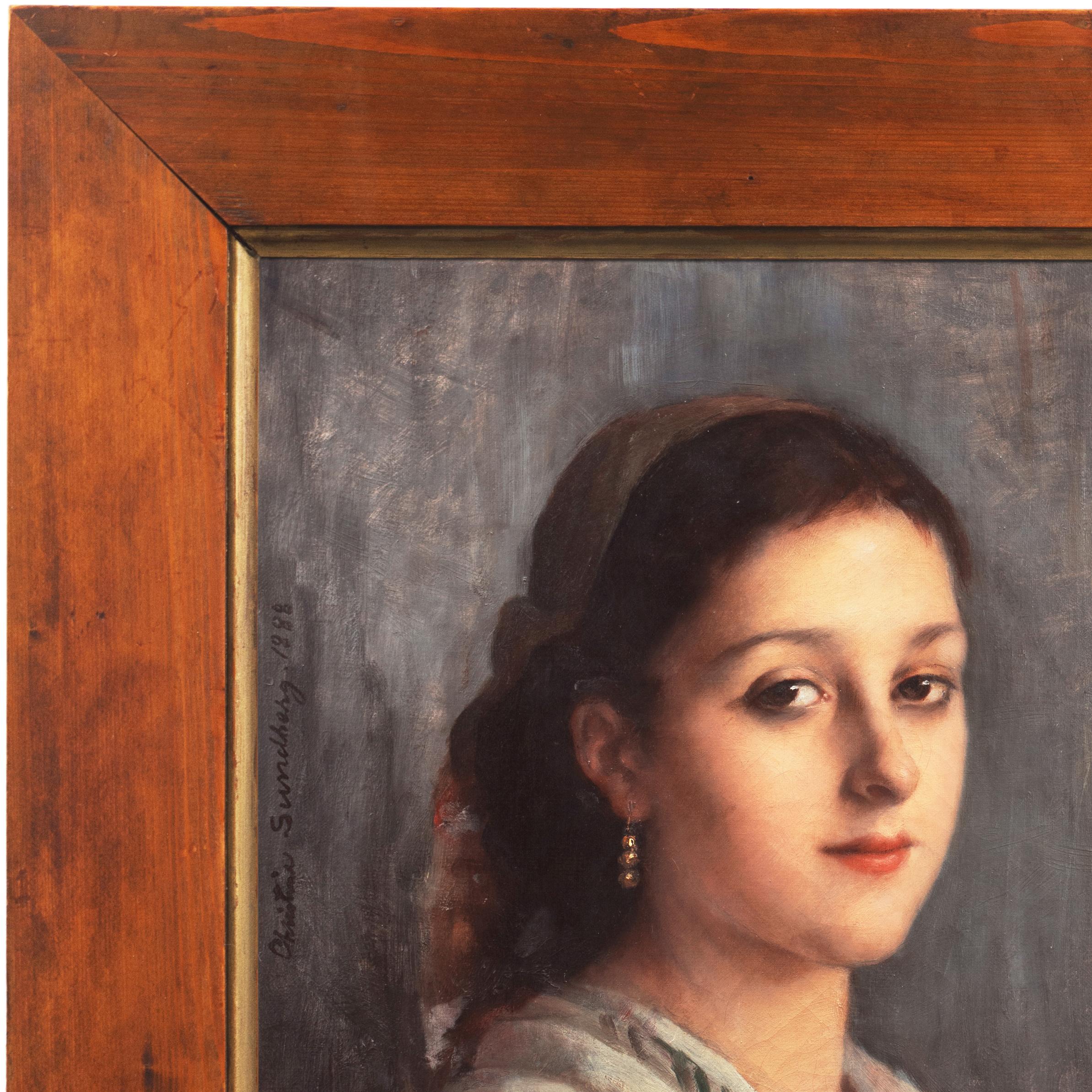 Jeune femme à la boucle d'oreille en or
