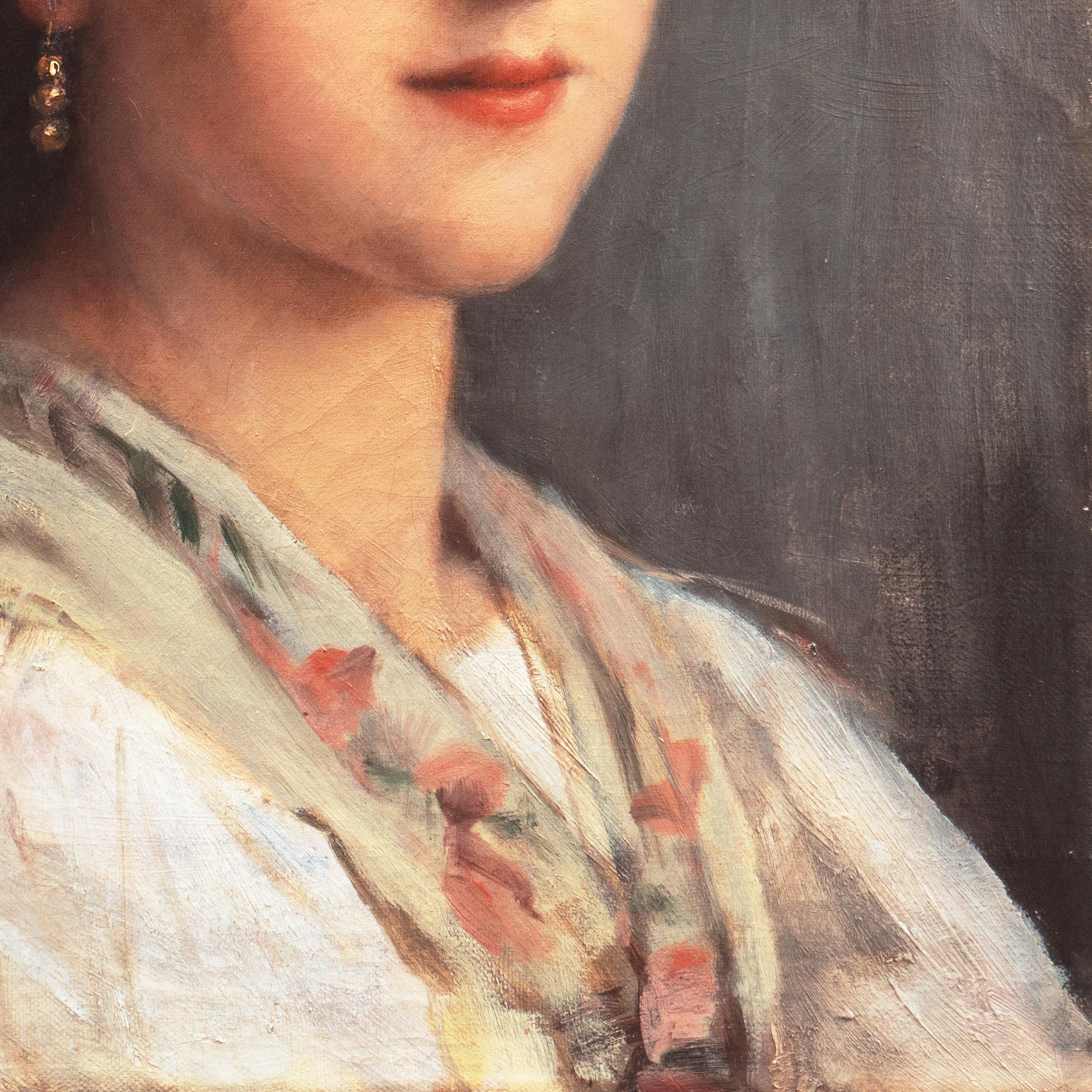Jeune femme à la boucle d'oreille en or