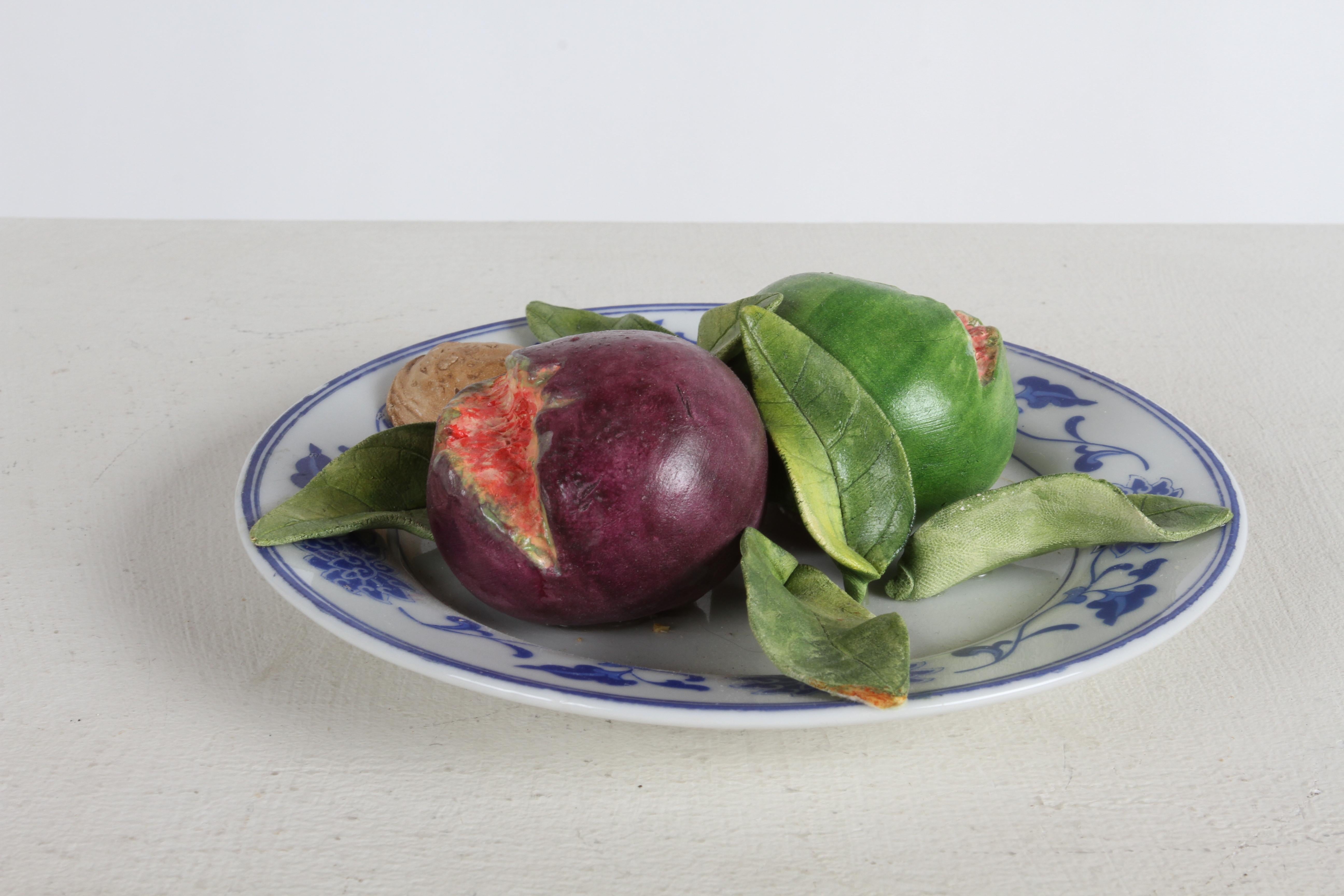  Trompe L'oeil majolica platter, hand crafted art plate of Star Apple fruit and leaves is on vintage china signed Christine Viennet on verso. My guess this is from late 1970s or early 80s, based from the estate it was purchased from. 

Christine