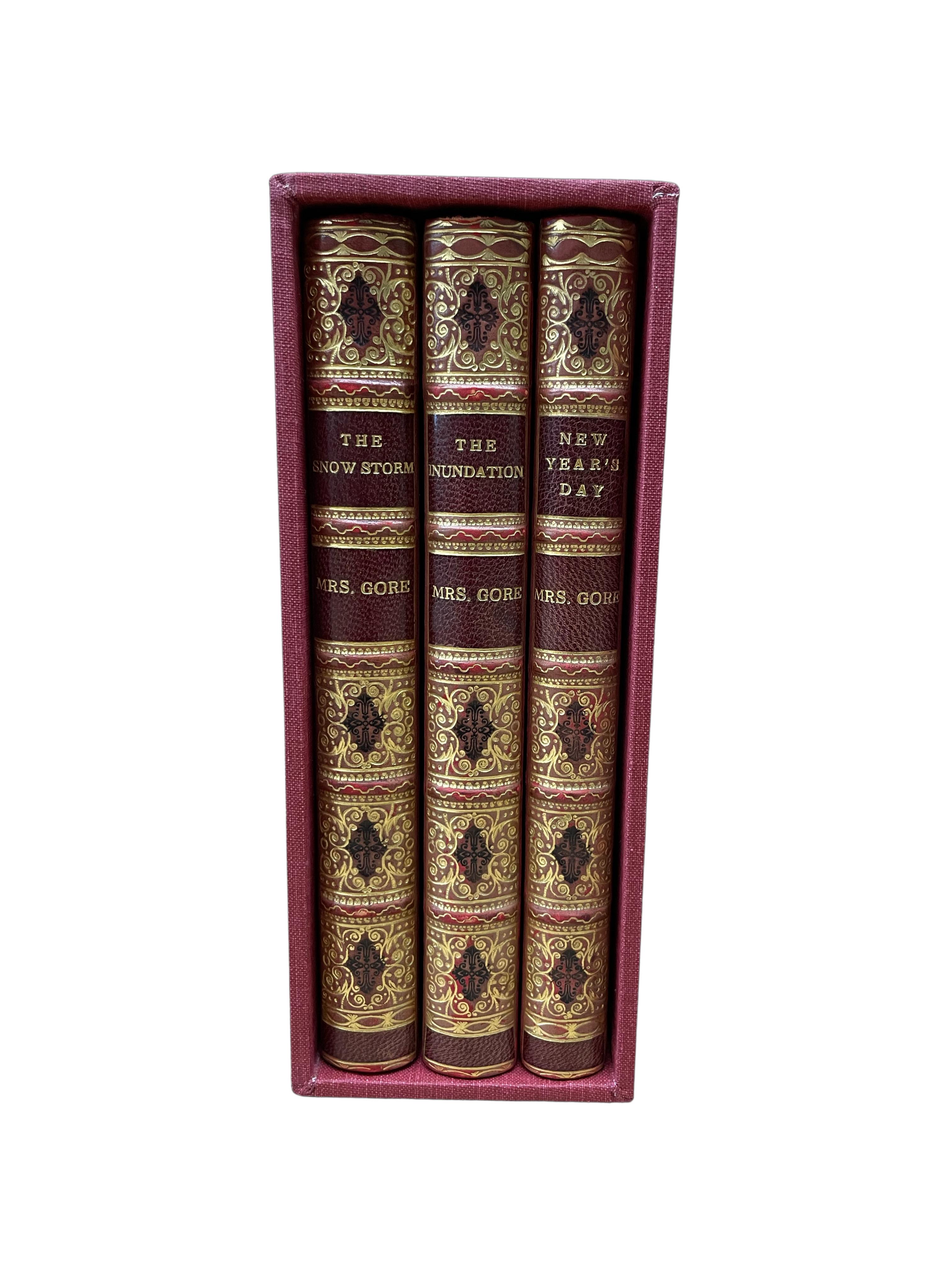 Gore, Catherine Grace Frances. The Snow Storm, A Christmas Story. [and] New Year's Day, A Winter Tale. [and] The Inundation; Or Pardon and Peace, A Christmas Story.  London: Fisher, Son & Co., [1847]. Three volumes, 12mo. All volumes illustrated by