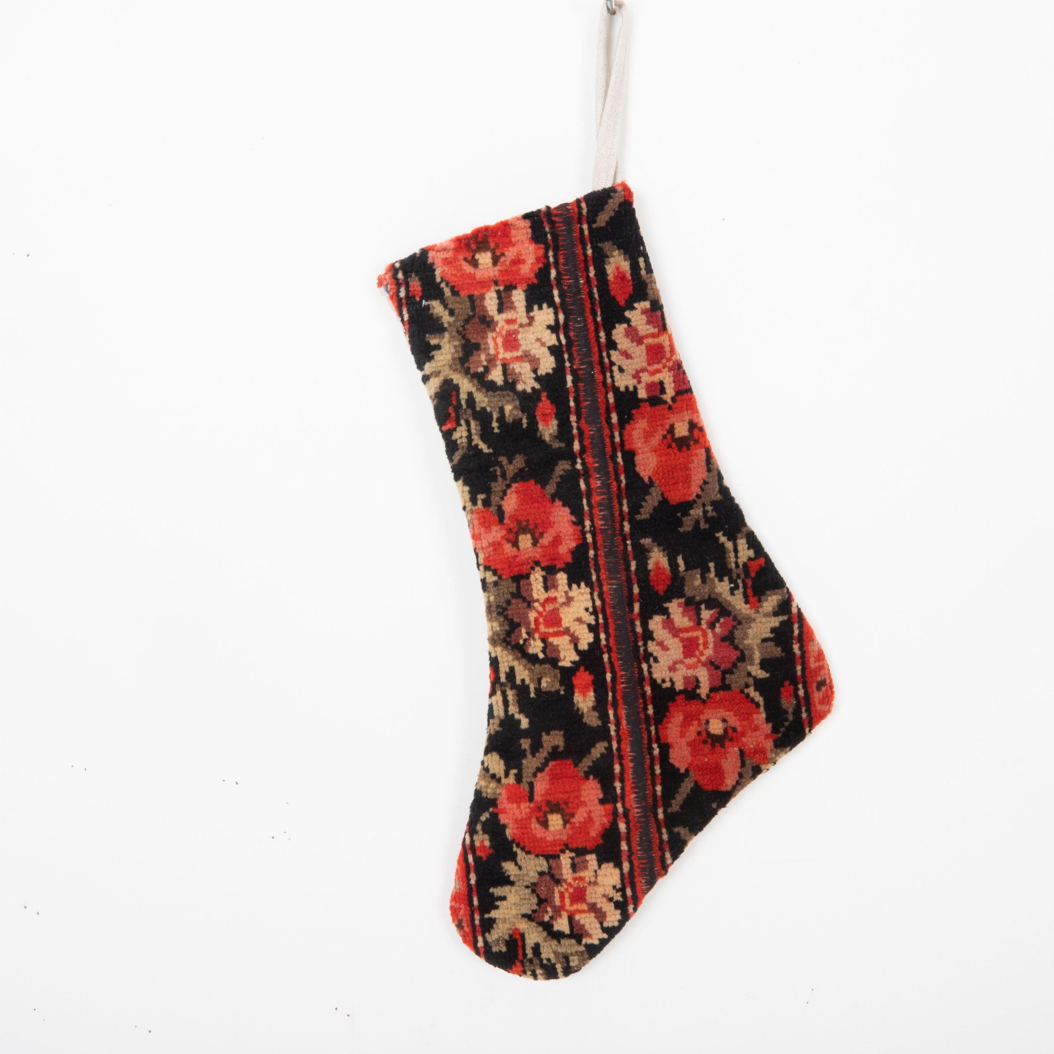 This Christmas Stocking was made from a late 19th or Early 20th C. Caucasıan rug fragments.
Linen in the back.

