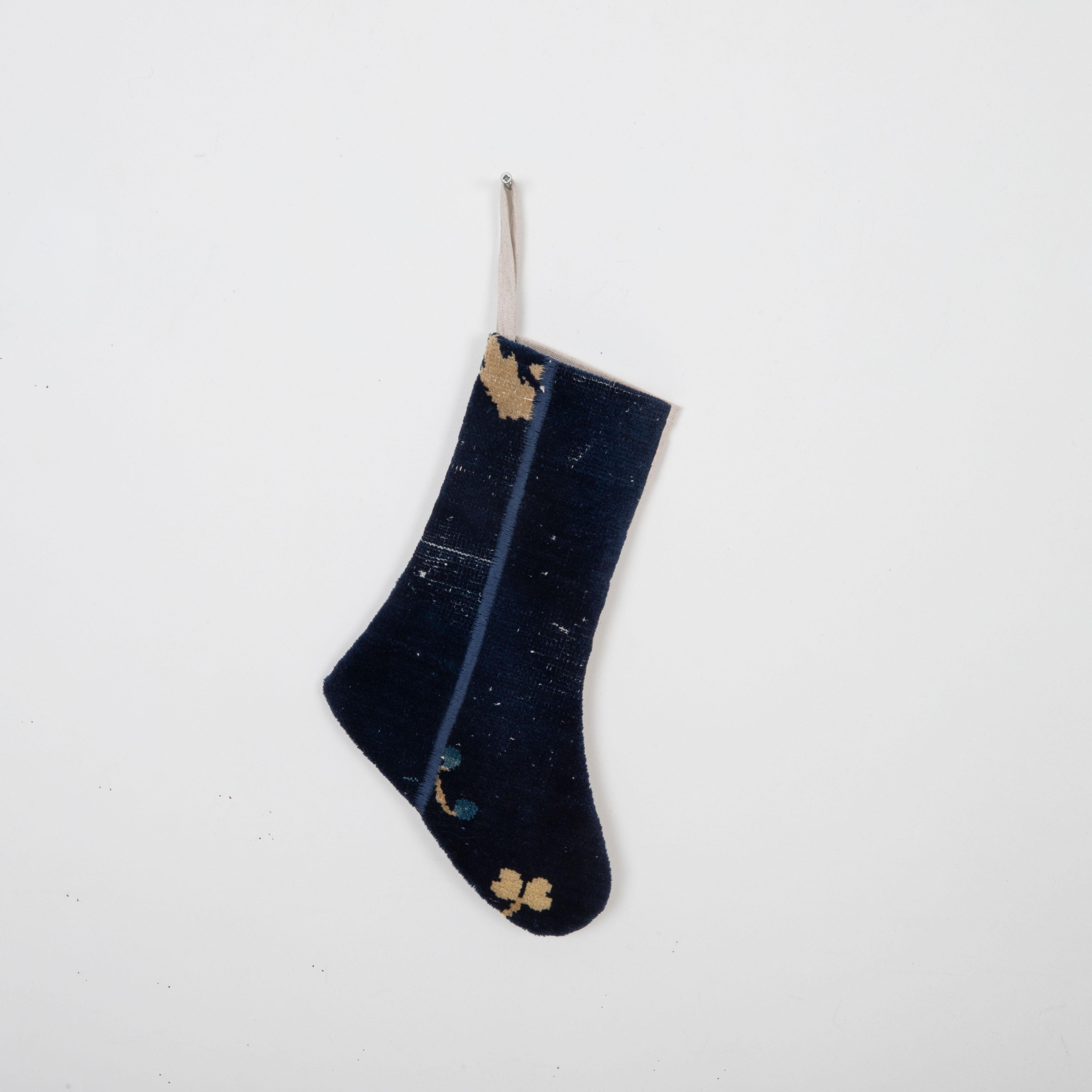 This Christmas Stocking was made from a late 19th or Early 20th C. Chinese rug fragments.
Linen in the back.

Please note, this stocking was made from Chinese rug fragments.
