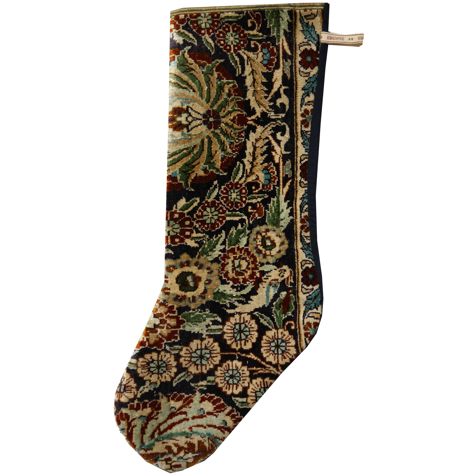 One of a kind Christmas stocking.
This Christmas stocking was made using a fine 650 knot per square inch Hereke silk rug. The front is 100% pure luxurious natural silk, the dark navy blue backing is cotton.

The Djoharian Design Collection is