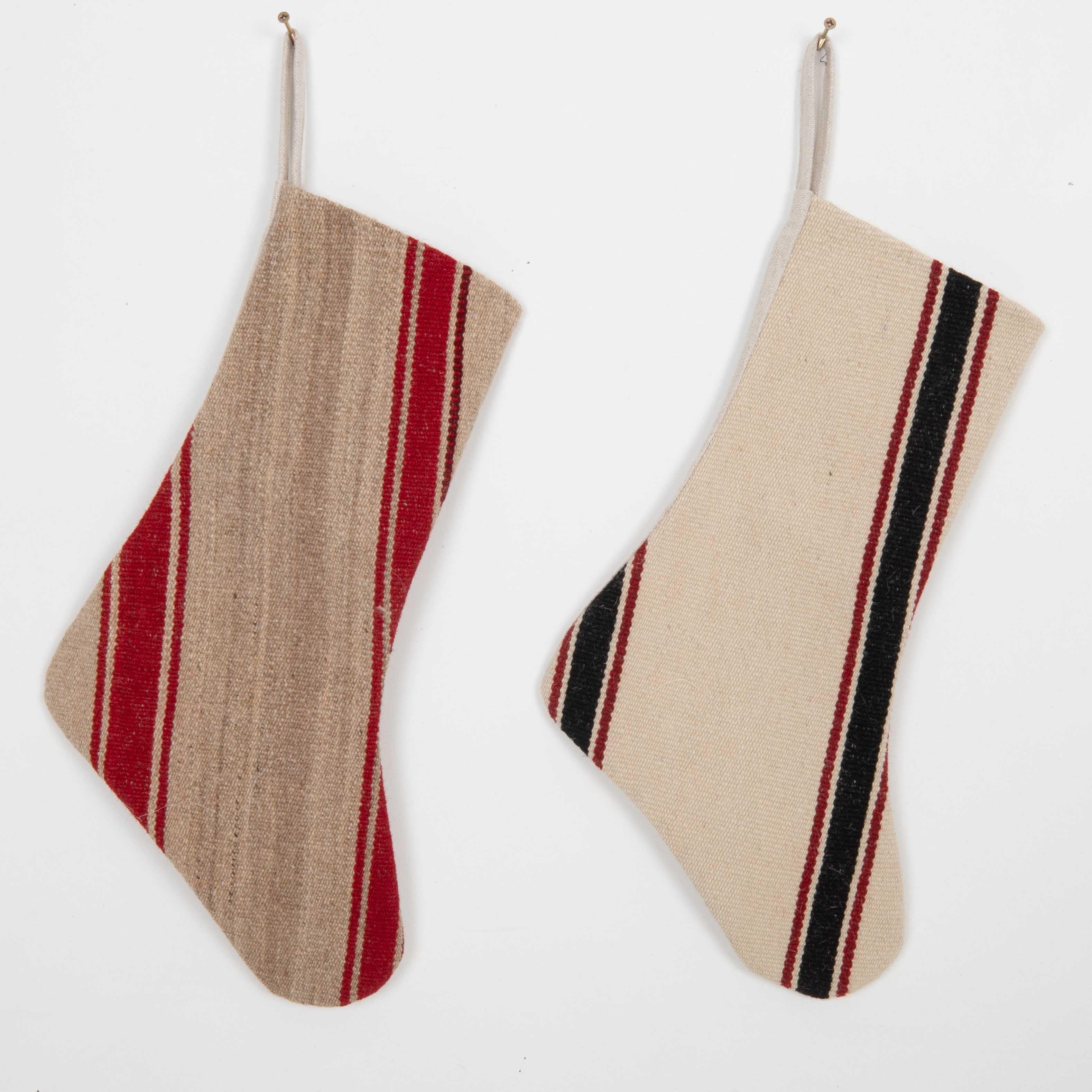 These Christmas Stockings were made from mid 20th C. Anatolian Kilim Fragments.


Please note, this stocking was made from kilim fragments.
