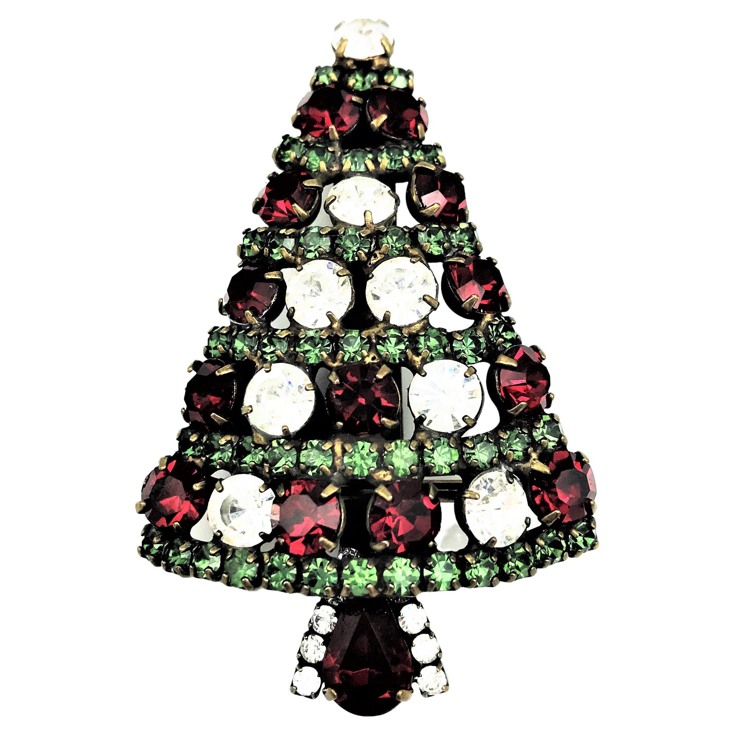Christmas is coming soon!       Who wouldn't want to adorn themselves with a Christmas tree brooch.

This sparkling treasure is designed and manufactured in California by Dorothy Bauer. She expresses her love of color in a witty and humorous