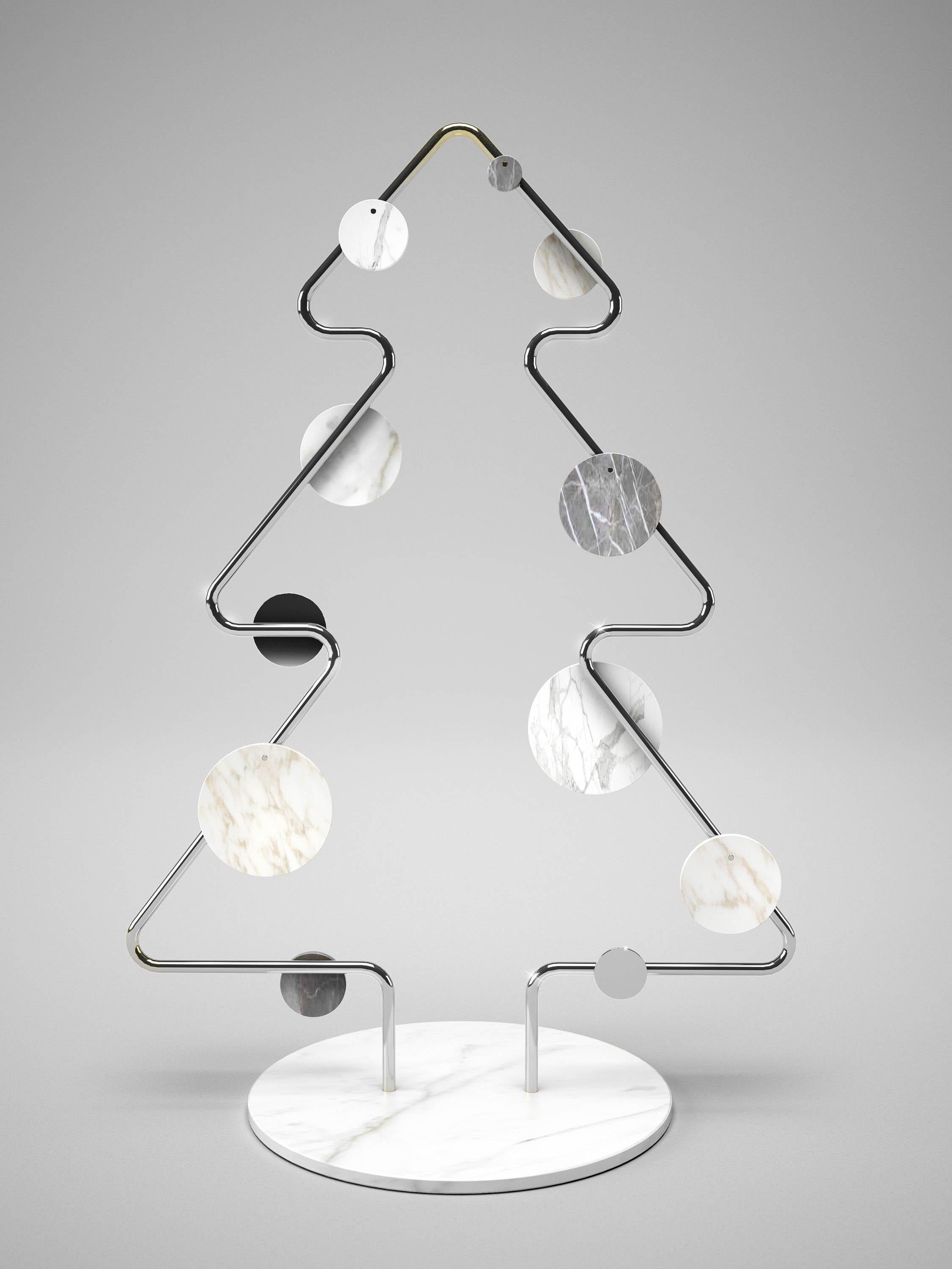 The very different, extra-ordinary X-mas tree made of mirror polished stainless steel or brass. Decorated with round or oval disks in marble.
The X-mas tree is available in two versions: one profile or double profiles.
The marble disks can be moved