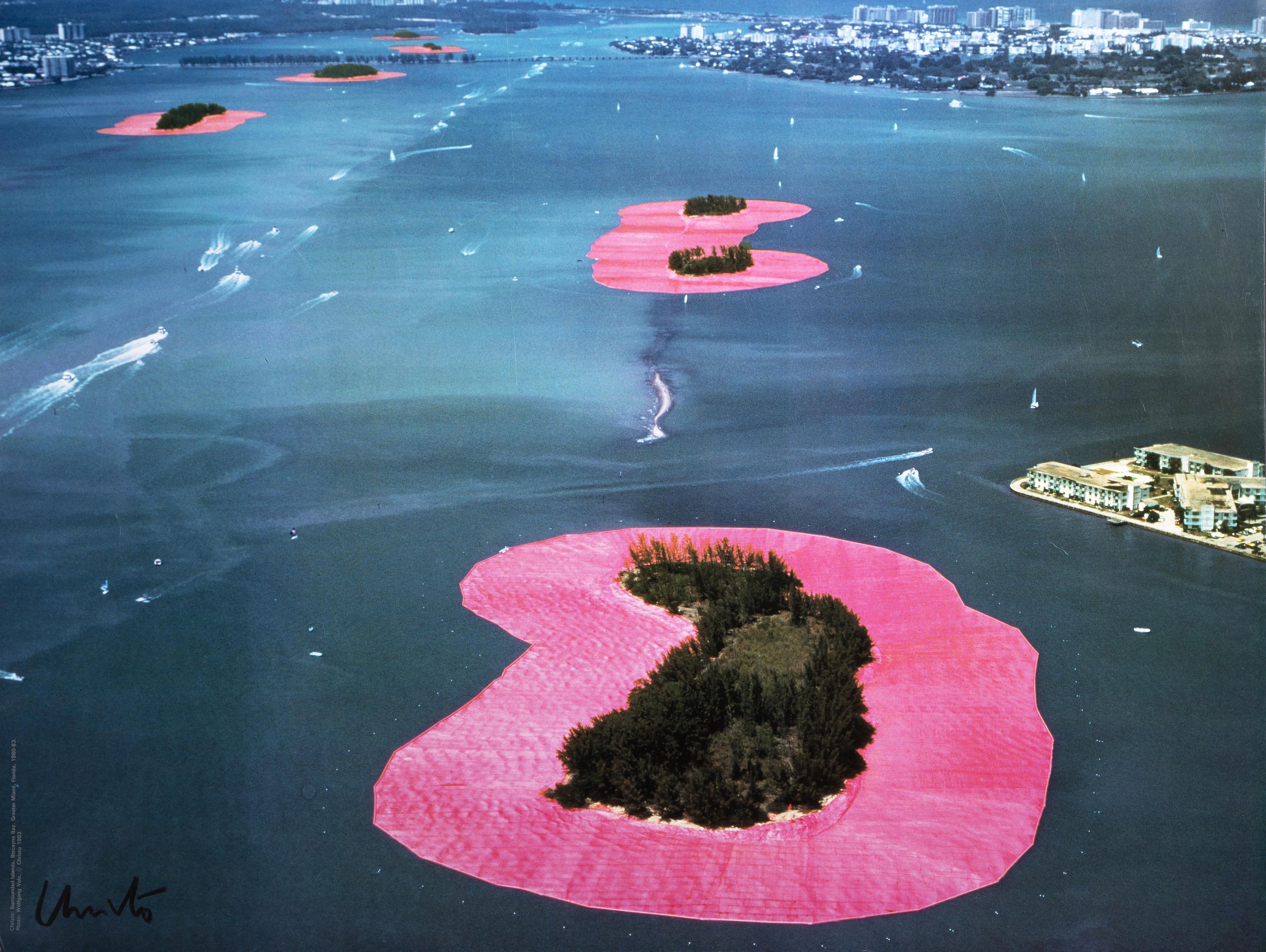  Christo and Jeanne-Claude, Bulgarian (1935 - 2020) - Surrounded Islands, Year: 1983, Medium: Poster, signed in marker, Size: 25 x 33 in. (63.5 x 83.82 cm), Description: Image by Wolfgang Volz.