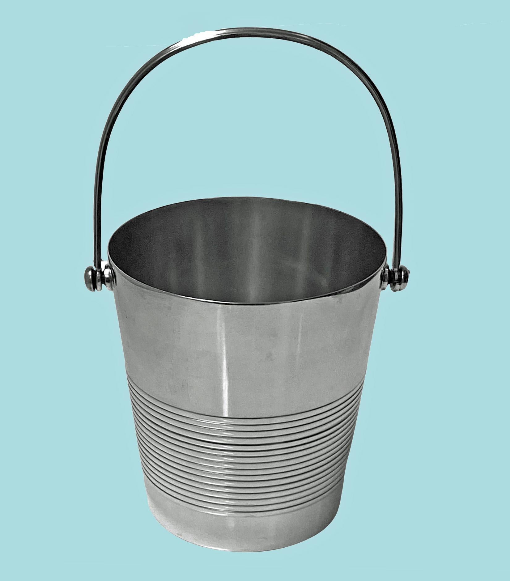 Christofle Art Deco silver plate wine bucket cooler, C.1930 Very slightly tapered form, plain with ribbed band surround, swing reeded handle, conforming in design. Marked with Christofle Marks on base. Height: 5.5 inches (excluding handle). To top