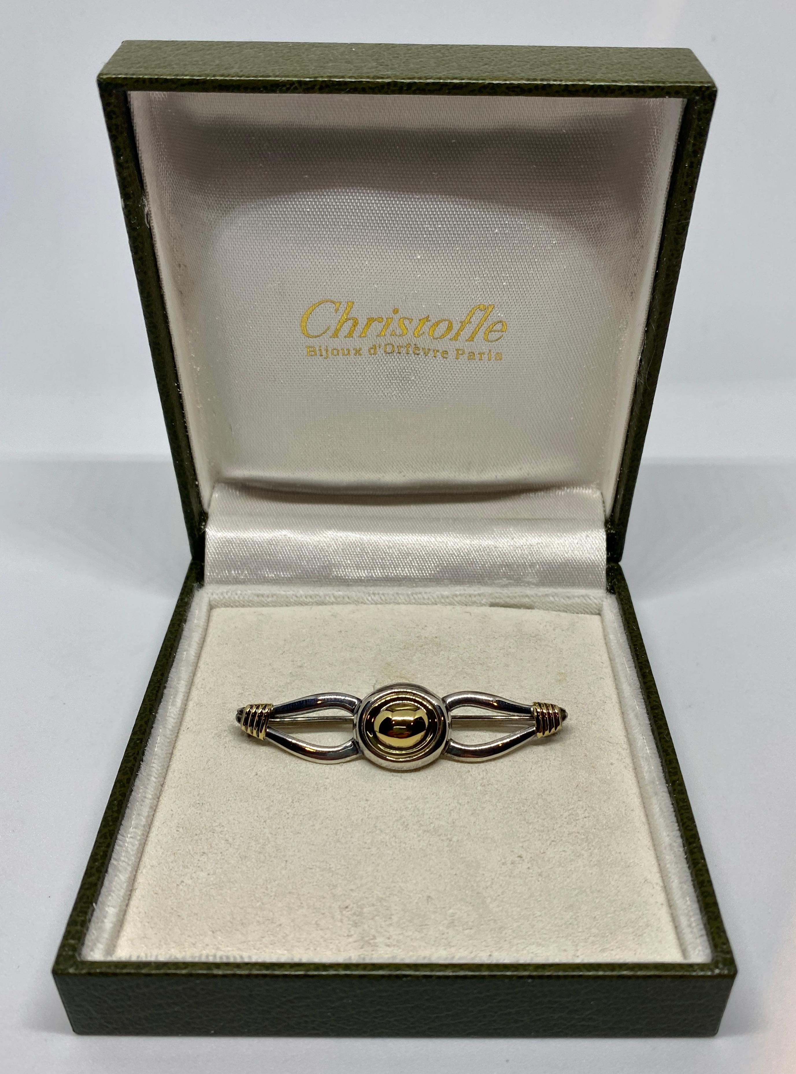 A modern brooch beautifully rendered in solid 18K yellow gold and sterling silver by Christofle.

Founded in 1830, Christofle began collaborating with independent jewelry designers beginning in the 1980s, producing very limited numbers of pieces