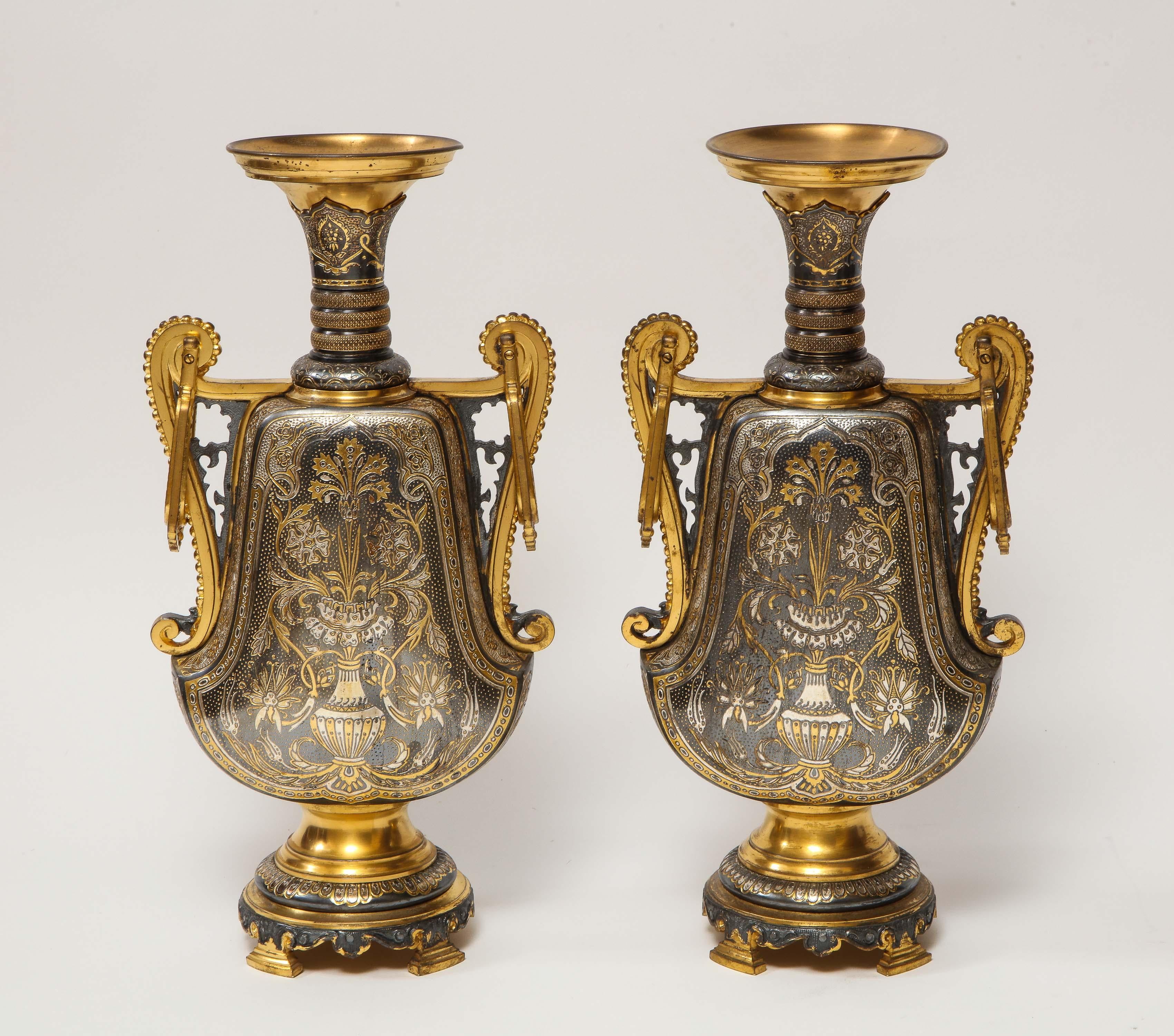 Christofle & Cie, a pair of French gilt and silvered bronze 