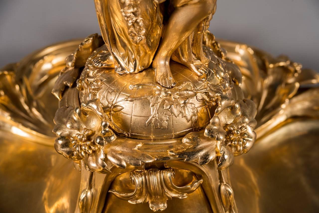 A large 20th century Christofle & Cie style gilt bronze 'Surtout Corbeille Trois Femmes' centerpiece

Measures: Height 23.5