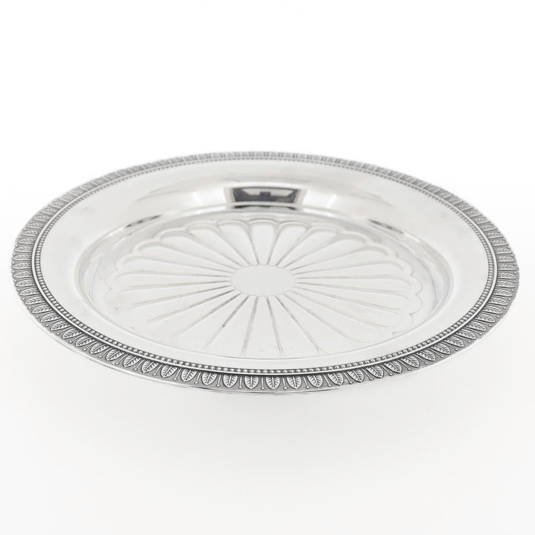 A fine, vintage silverplated wine coaster.

By Christofle.

In the Malmaison pattern.

With the typical lotus leaf border and a stylized starburst center.

Perfect for any well-set table!

Date:
20th Century

Overall Condition:
It is in overall