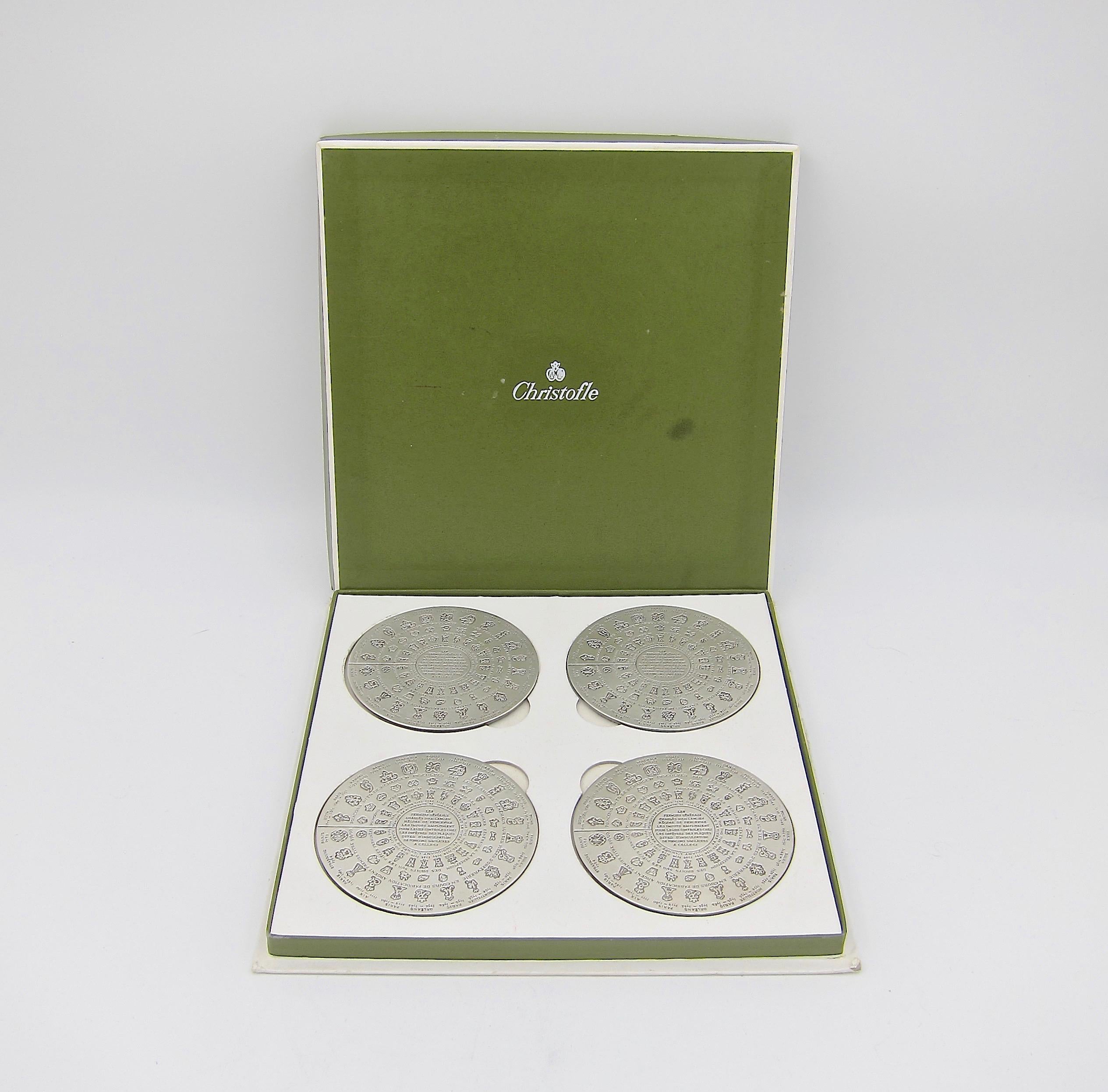 A Christofle of Paris set of 4 vintage coasters commemorating the Farmers Généraux, a 17th and 18th century tax collecting organization charged with collecting duties on behalf of the King of France. The marks on these pieces are copies of the