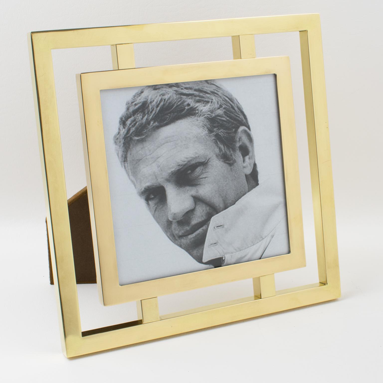 This most amazing and unusual 1970s brass picture frame was designed by silversmith Christofle, Paris. The design is pretty elegant and features solid brass square tubes with polished finishing. Glass protection for the photograph. Marking with a
