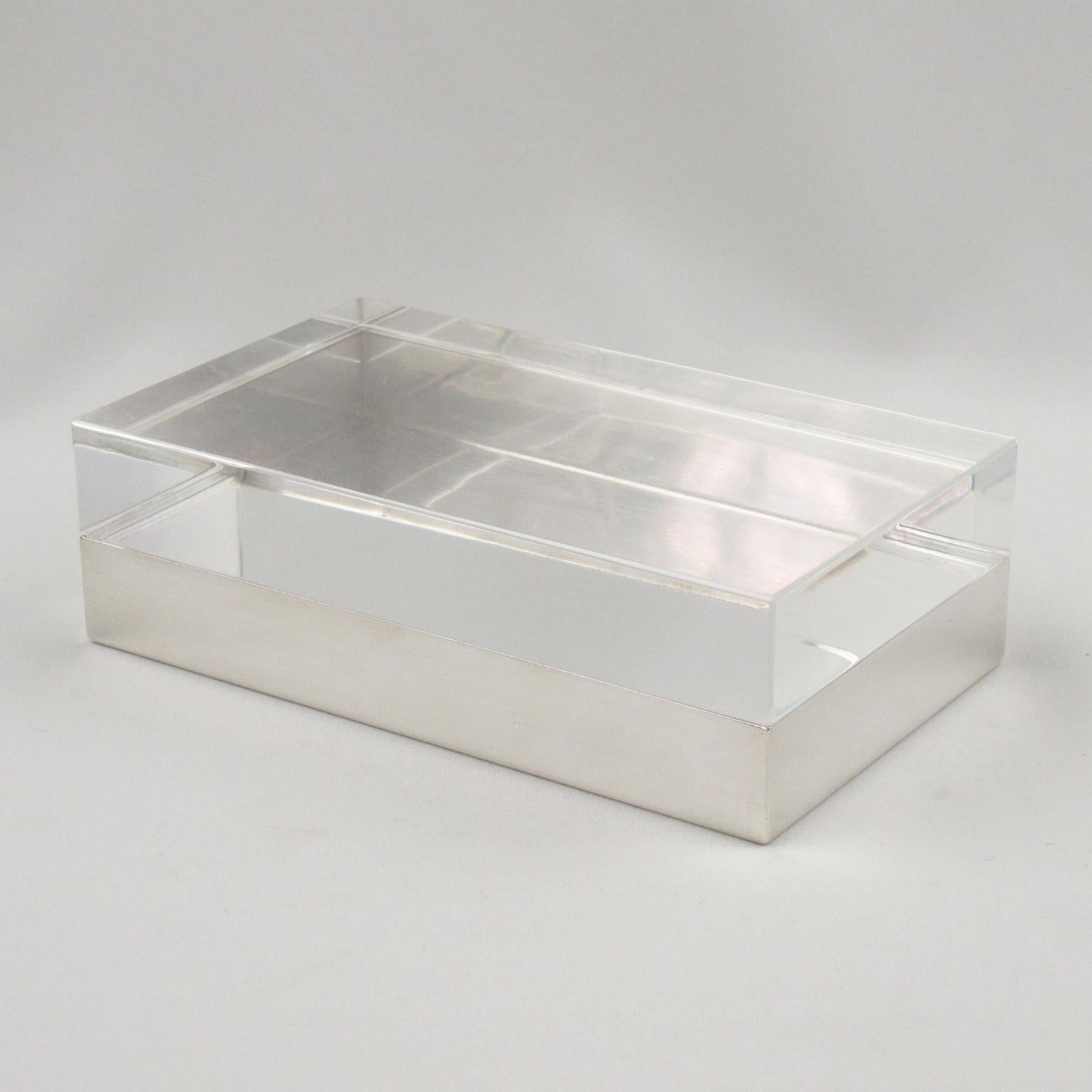 Elegant 1970s modernist decorative box designed by Christofle France. Geometric shape with silver plate base and thick crystal clear Lucite lid. Marked on side: Christofle France with legal hallmarks.
(This sale is for one single box).
Please note