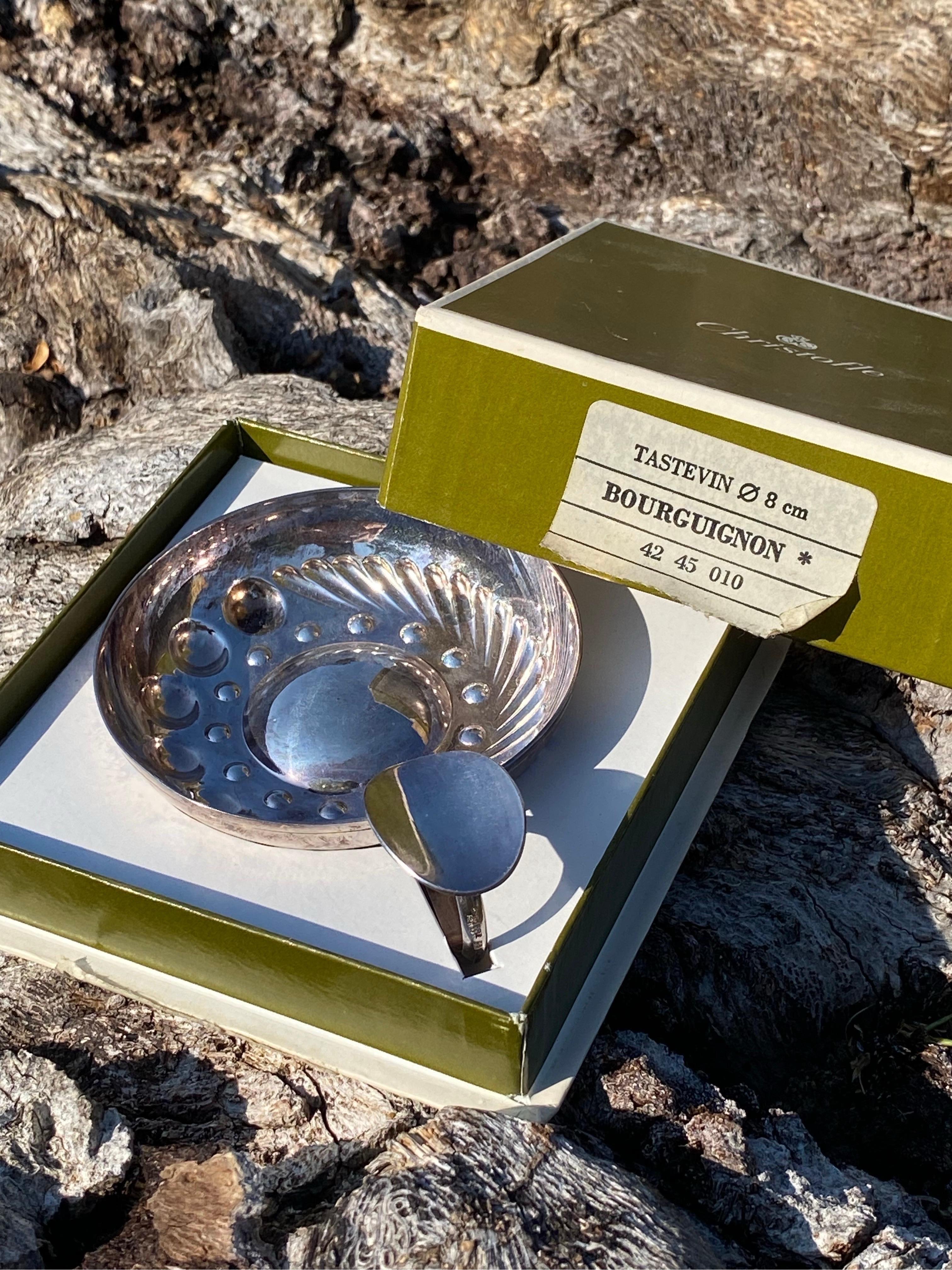 New old stock in the box Christofle Bourguignon Tastevin. Has a patina to the silver-plate.