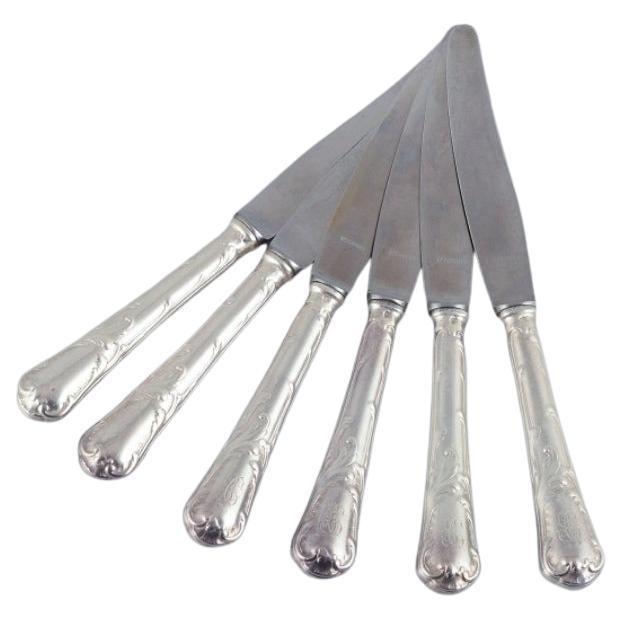 Christofle, Francia. Seis cuchillos de plata chapada y acero inoxidable.