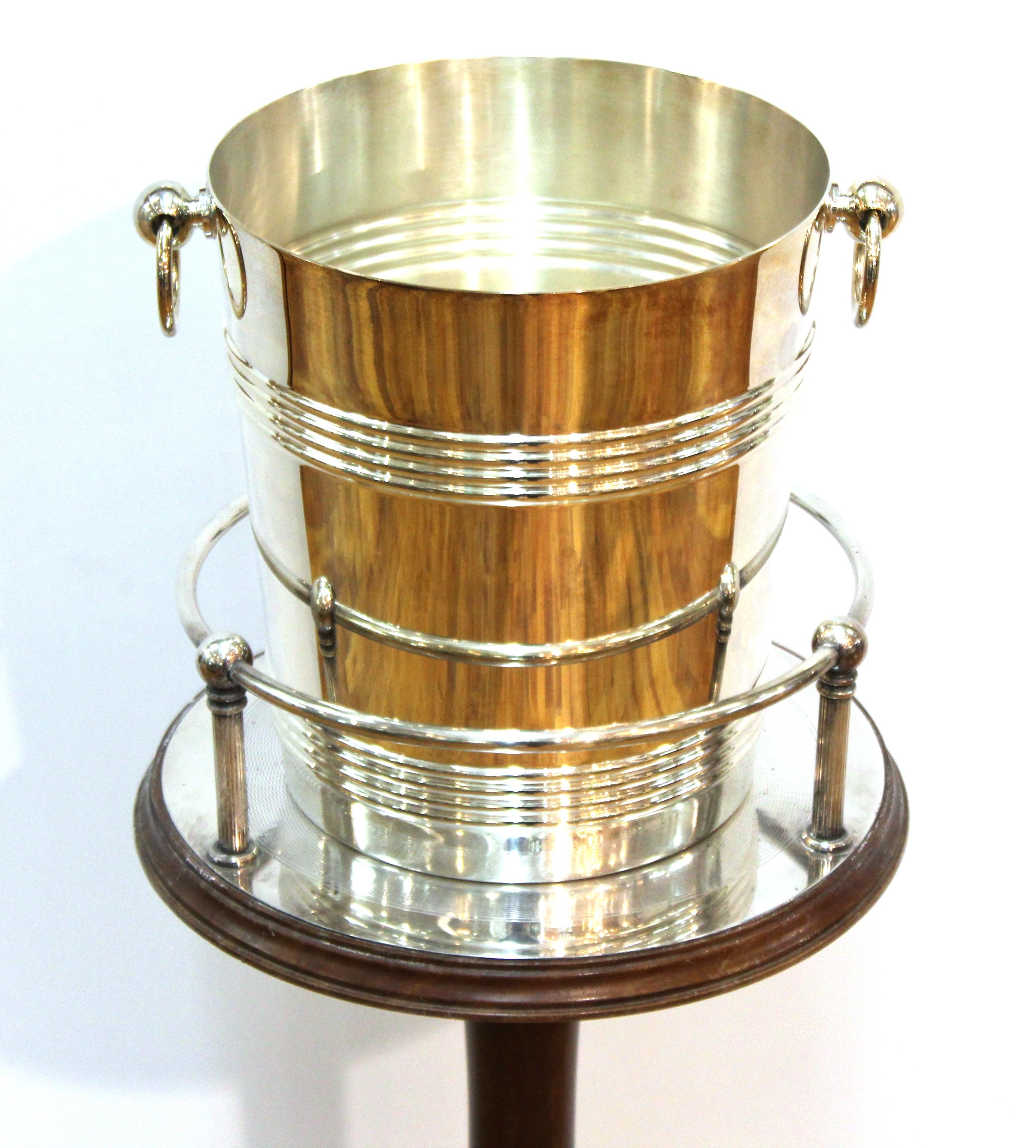 French Art Deco silver plated and mahogany champagne stand with coordinating silver plated champagne bucket, made by Christofle. Both pieces signed Christofle, made in France during the 1940s. Very good vintage condition with age-appropriate wear