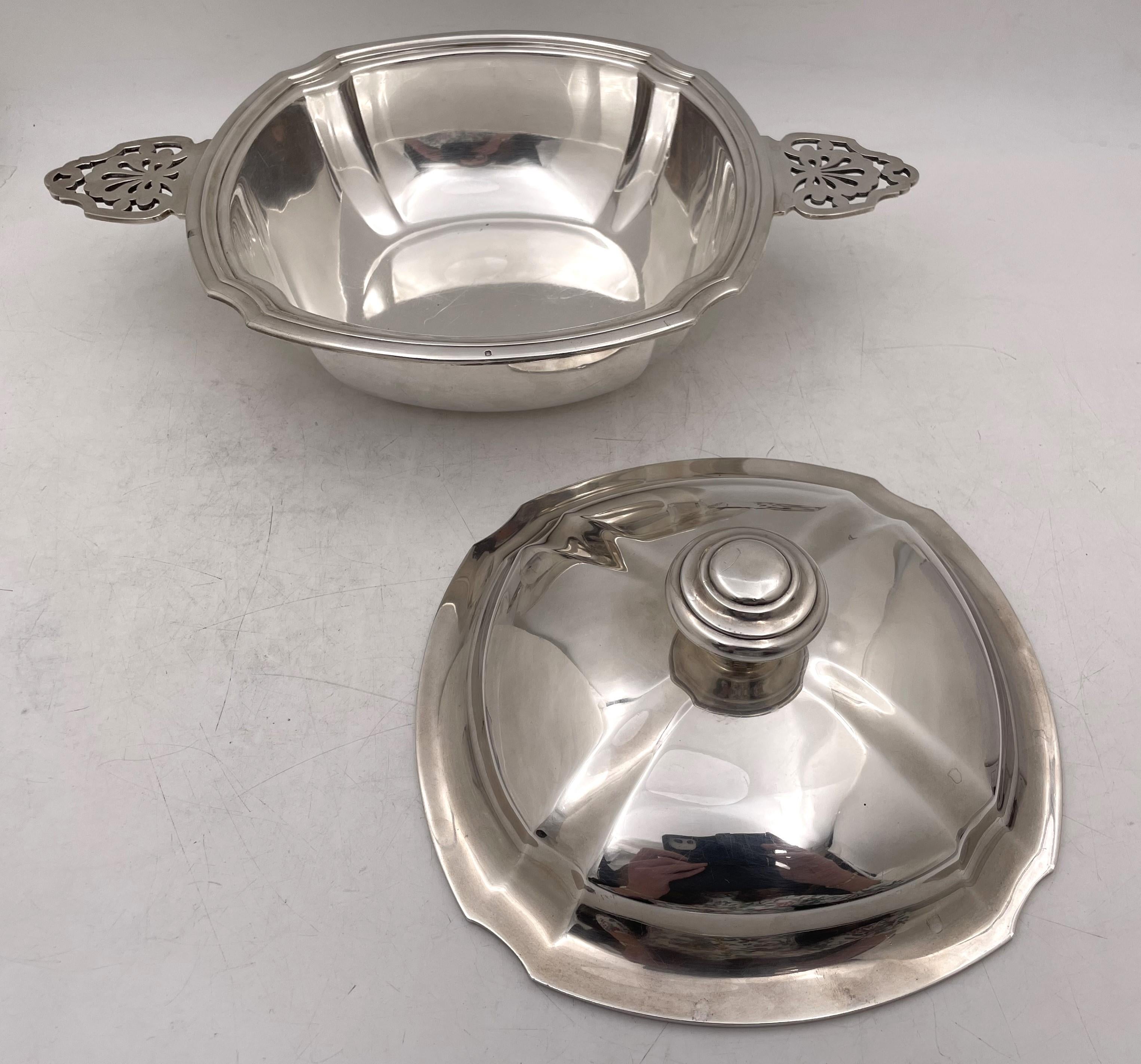 Christofle, French, 0.950 (higher purity than sterling) silver two-handled covered dish bowl or tureen in Art Deco style, with an elegant, geometric design, from the early 20th century, measuring 14 3/4'' from handle to handle by 9 3/4'' in depth by