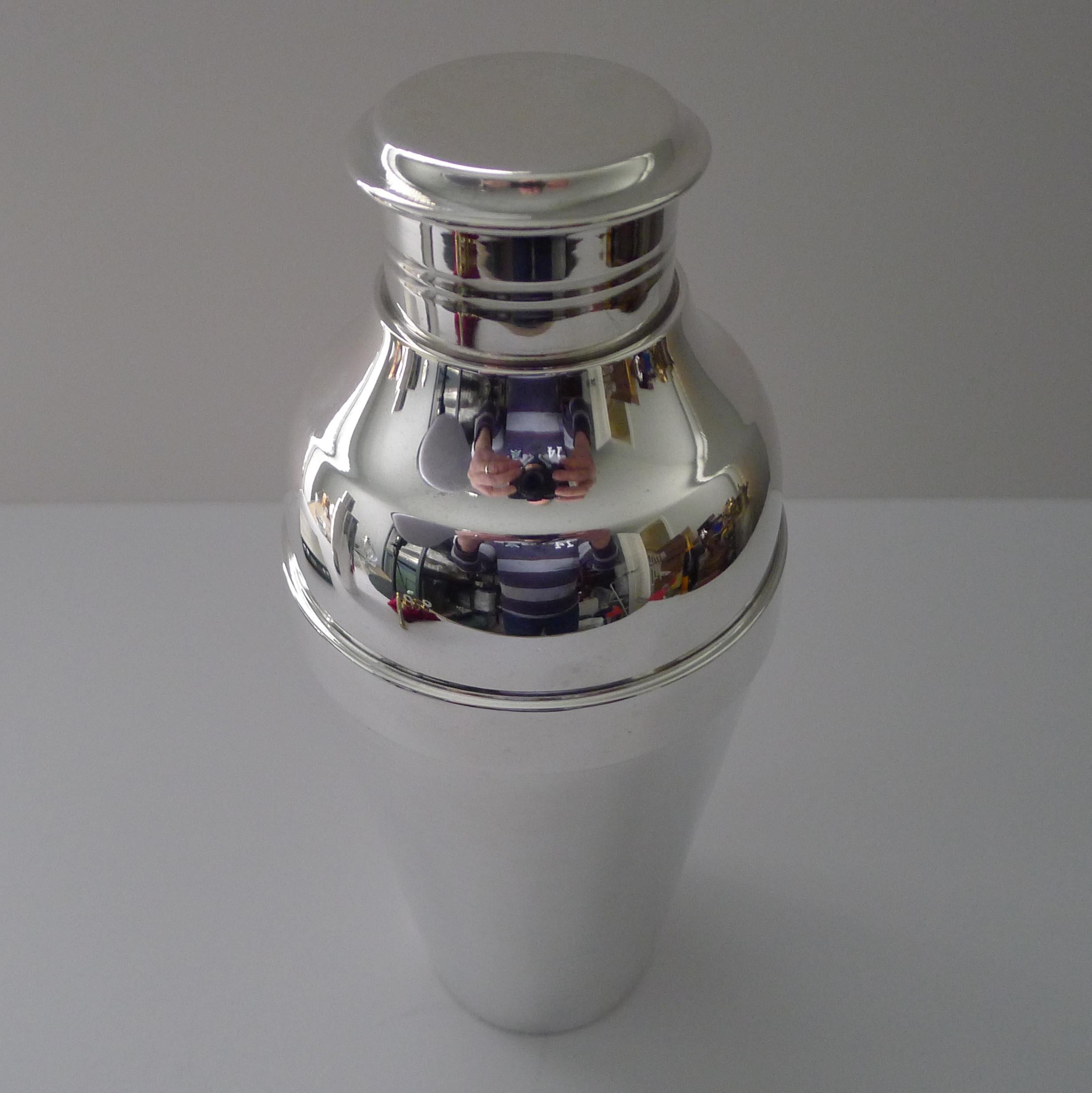 A handsome Art Deco silver plated cocktail shaker by top quality silversmith Christofle as part of their Gallia range in the Ondulations design.

This design was created for the luxury liner SS Normandie by the designer Luc Lanel. This grand Ocean
