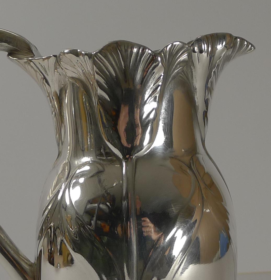 A highly decorative silver plated jug or pitcher with an integral raised Art Nouveau Tulip design.

Fully marked on the underside with the legendry Gallia mark.

A wonderful Art Nouveau piece created in Paris c.1910. Excellent condition