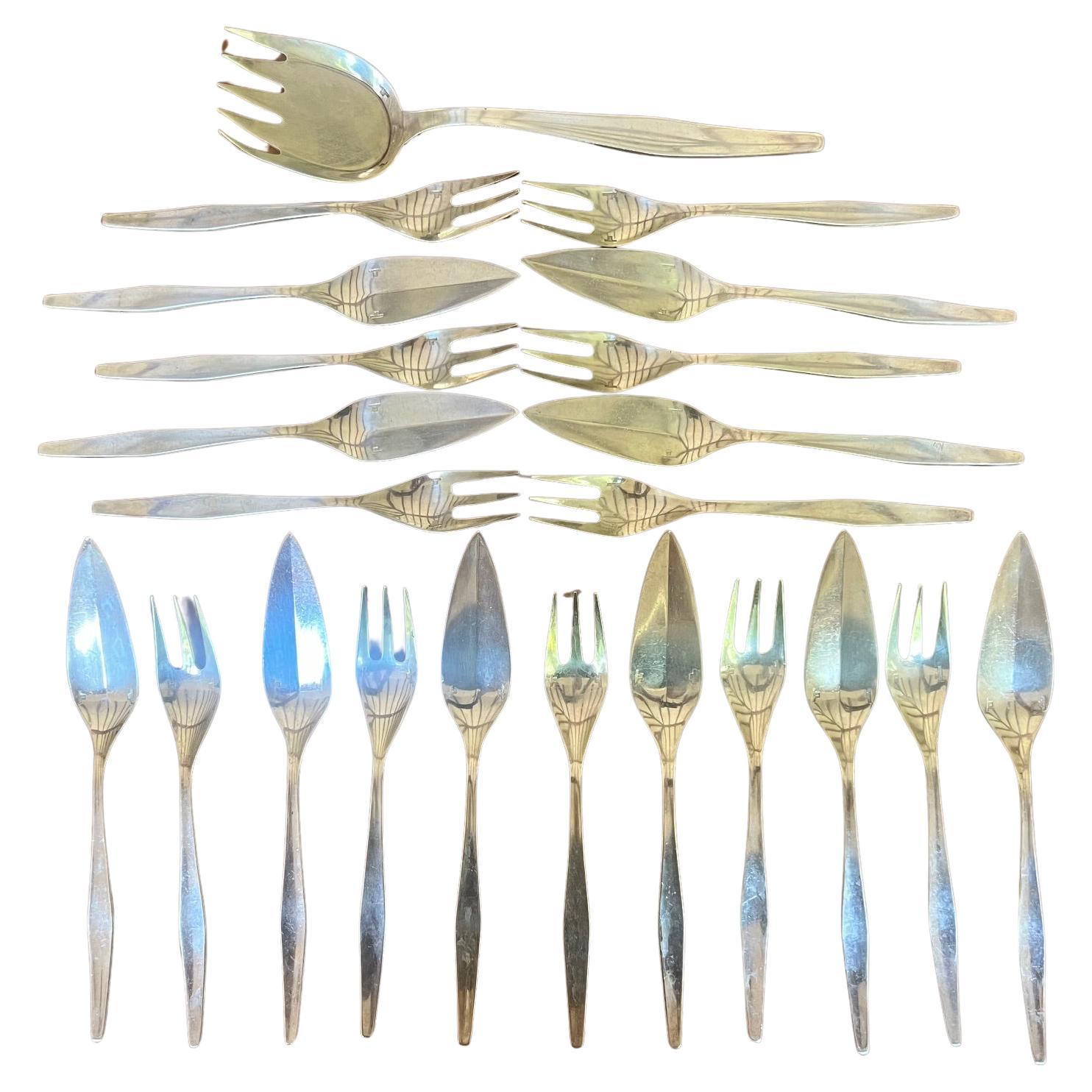 Christofle fish service flatware set and serving fork designed by Lino Sebatti in France in the late 1950's/ early 1960's.  The silverplated flatware is in a pattern called 