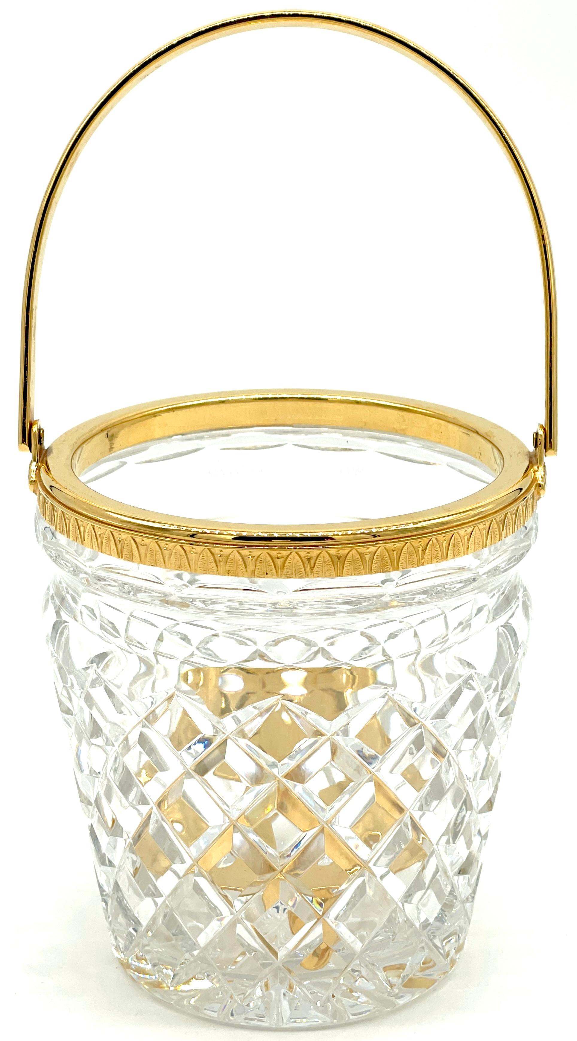 Christofle Neoclassical Cut Crystal Gold Washed Swing-Handled Ice Bucket, With Ice Strainer 
France, circa 1960s

A Exquisite Christofle Neoclassical Cut Crystal Gold Washed Swing-Handled Ice Bucket with Ice Strainer, made in France during the
