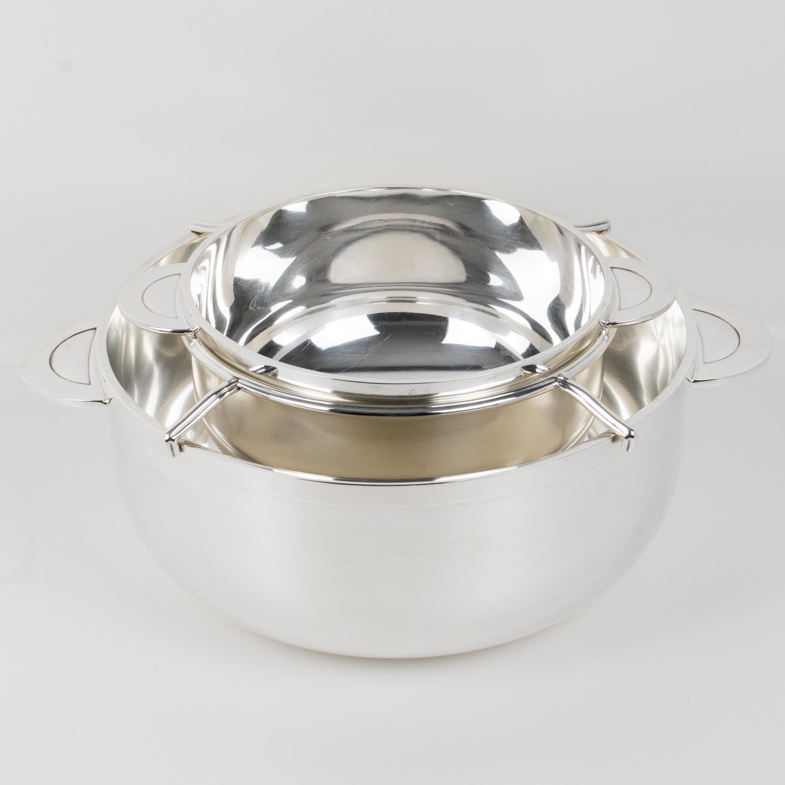 This stylish French Art Deco silver plate caviar serving bowl, dish, or chiller was designed by silversmith Christofle in the 1940s. 
This set features a two-handled rounded outer ice bowl container decorated with a minimalist chic design and a