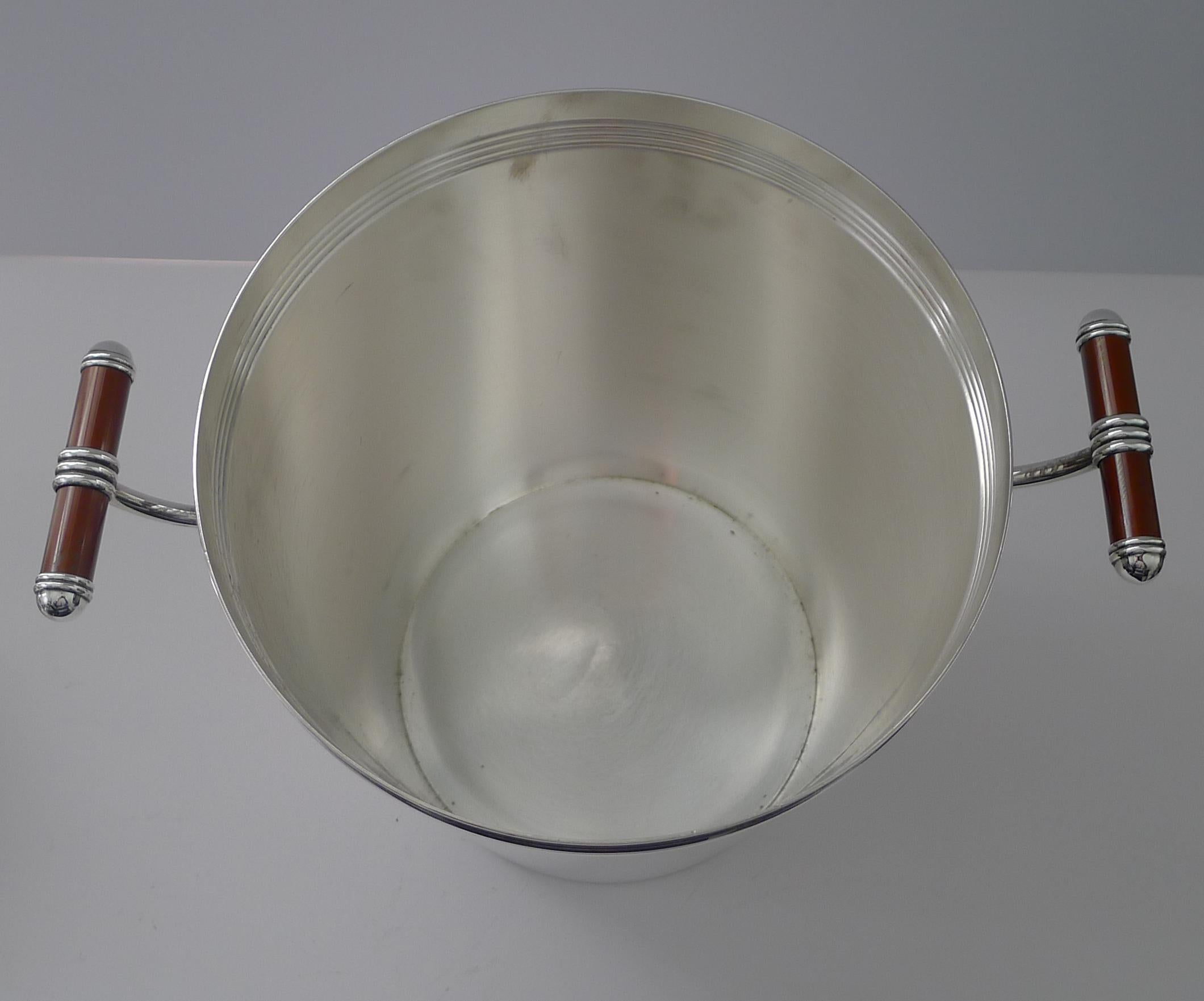 A fabulous vintage Champagne bucket or wine cooler made from silver plate by the top-notch silversmith's, Christofle of Paris.  This is the larger of the two sizes made in this design.

Dating to the late twentieth century c.1990; this is a hard