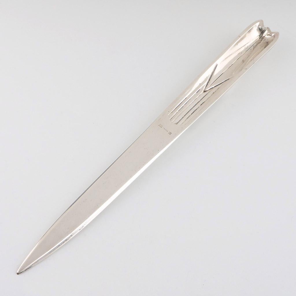 An Art Deco silvered bronze automotive letter opener by Christofle Paris. Hallmarked and stamped 'Christofle' to side. Original labelled box.