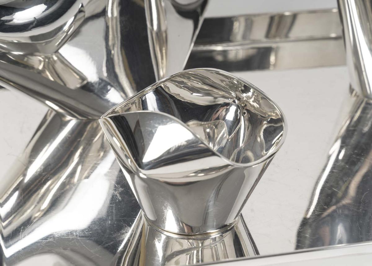 CHRISTOFLE-CARDEILHAC & Lino SABATTINI (born in 1925), designer. COMO model, created circa 1956-1957. Modernist tea and coffee service in solid silver comprising four pieces: coffee pot, teapot, sugar bowl, and milk jug. Plain silver, and a