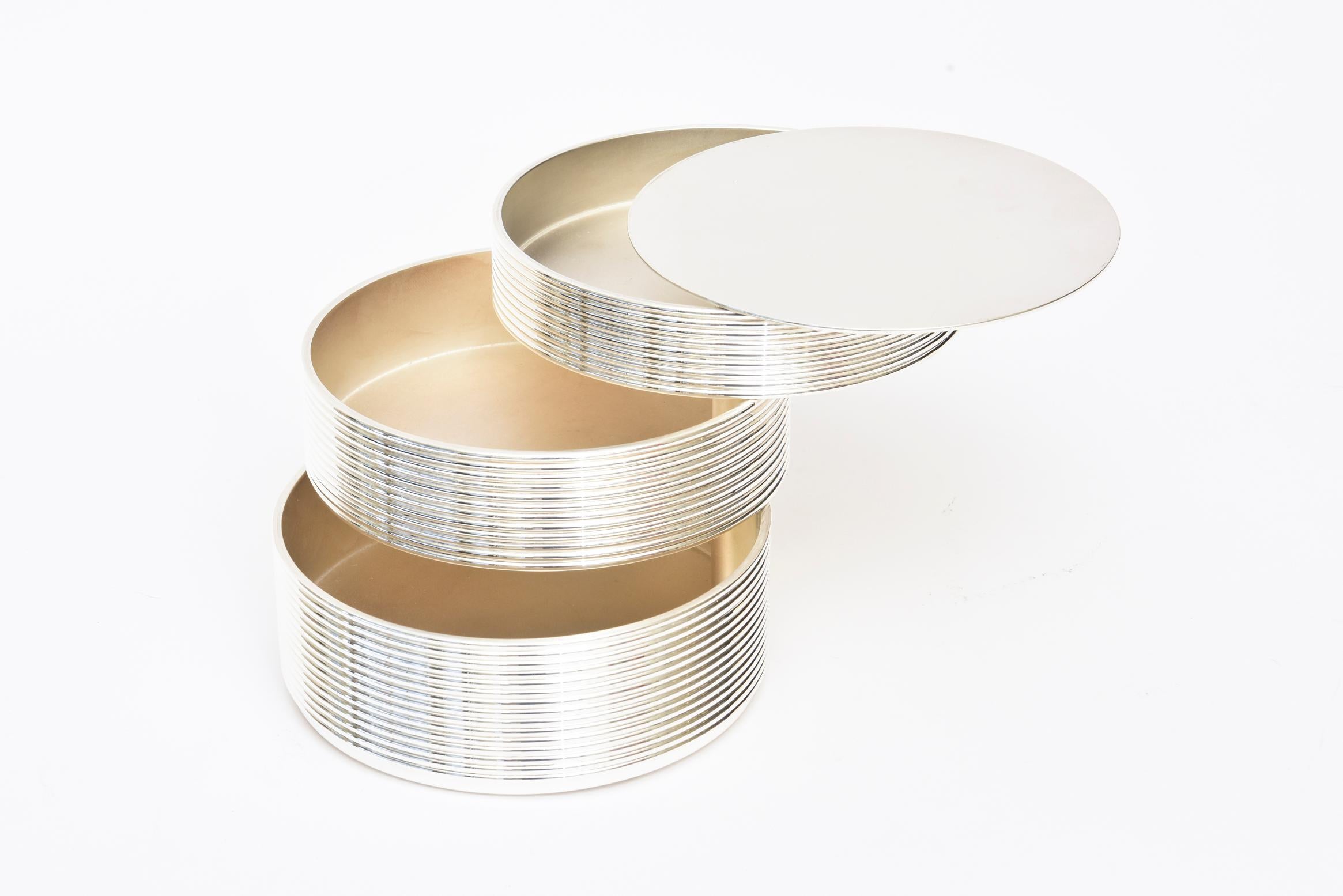 This fabulous signed Christofle 3-tiered silver-plate box, desk accessory, cocktail table addition and or barware, serving piece cantilevers out. It was designed by KT Studio in 1998 for Christofle. The 2 designers of that studio are Thomas Keller