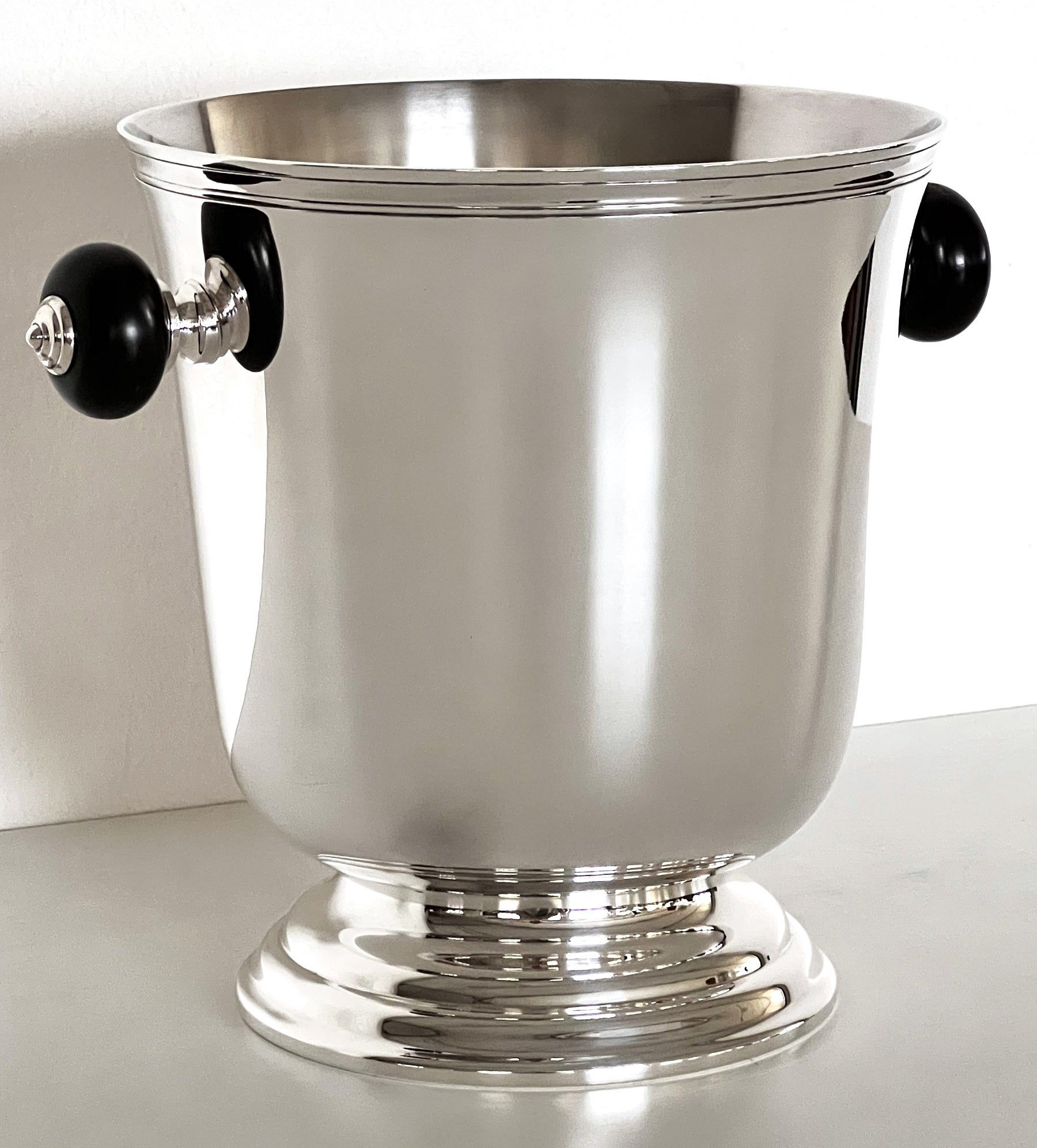 Gorgeous and very shiny, classic and timeless French Christofle silver plated champagne bucket or wine cooler; it's a stunning piece to keep forever.
The bucket is silver-plated, with ebony handles ( even printed 