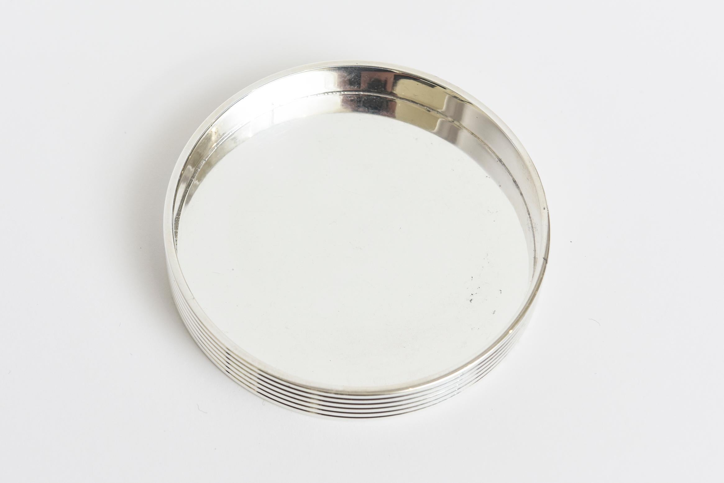 This classic Christofle silver plate wine, bottle, water or champagne coaster or holder is from the K&T collection. It is modernist with 6 beautiful ridged lines as the exterior. This is from 2000. It is hallmarked Christofle K&T. Perfect for all