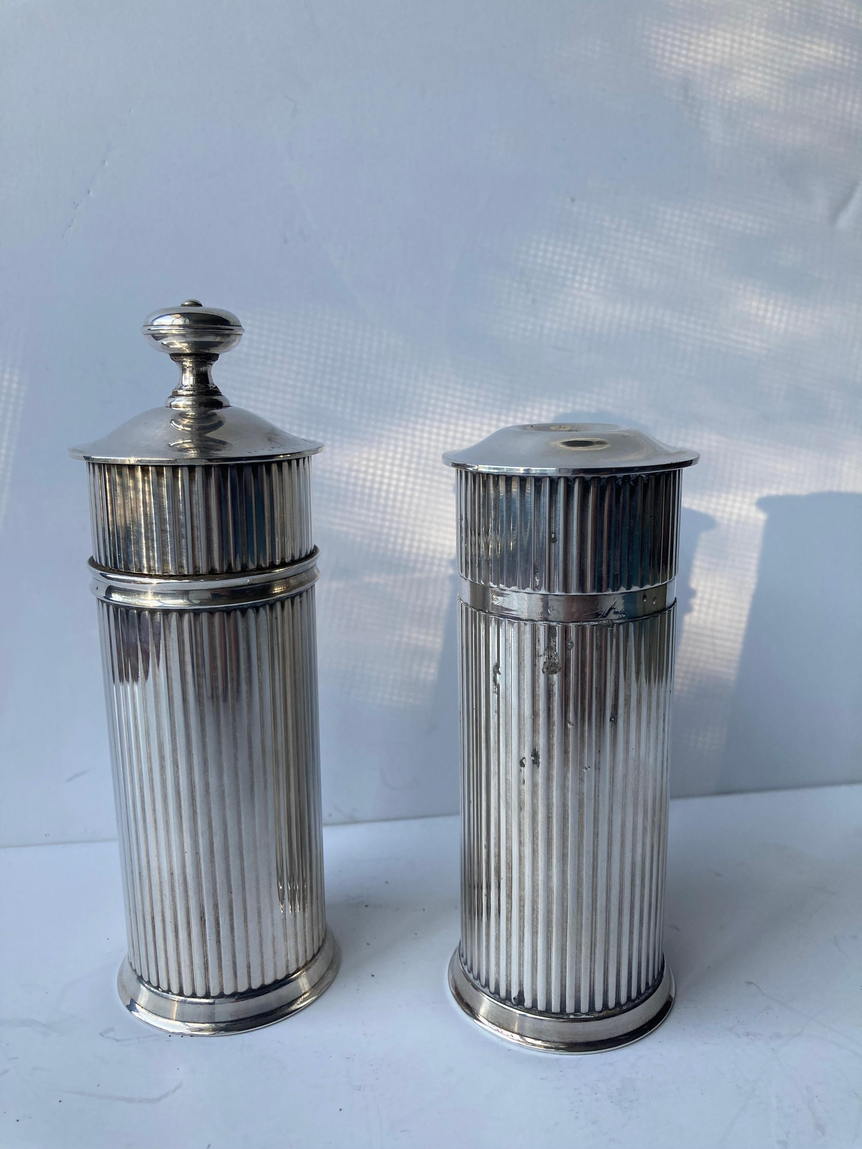 Nice and classy set of silver plate Salt and Pepper Mill, marked on bottom.