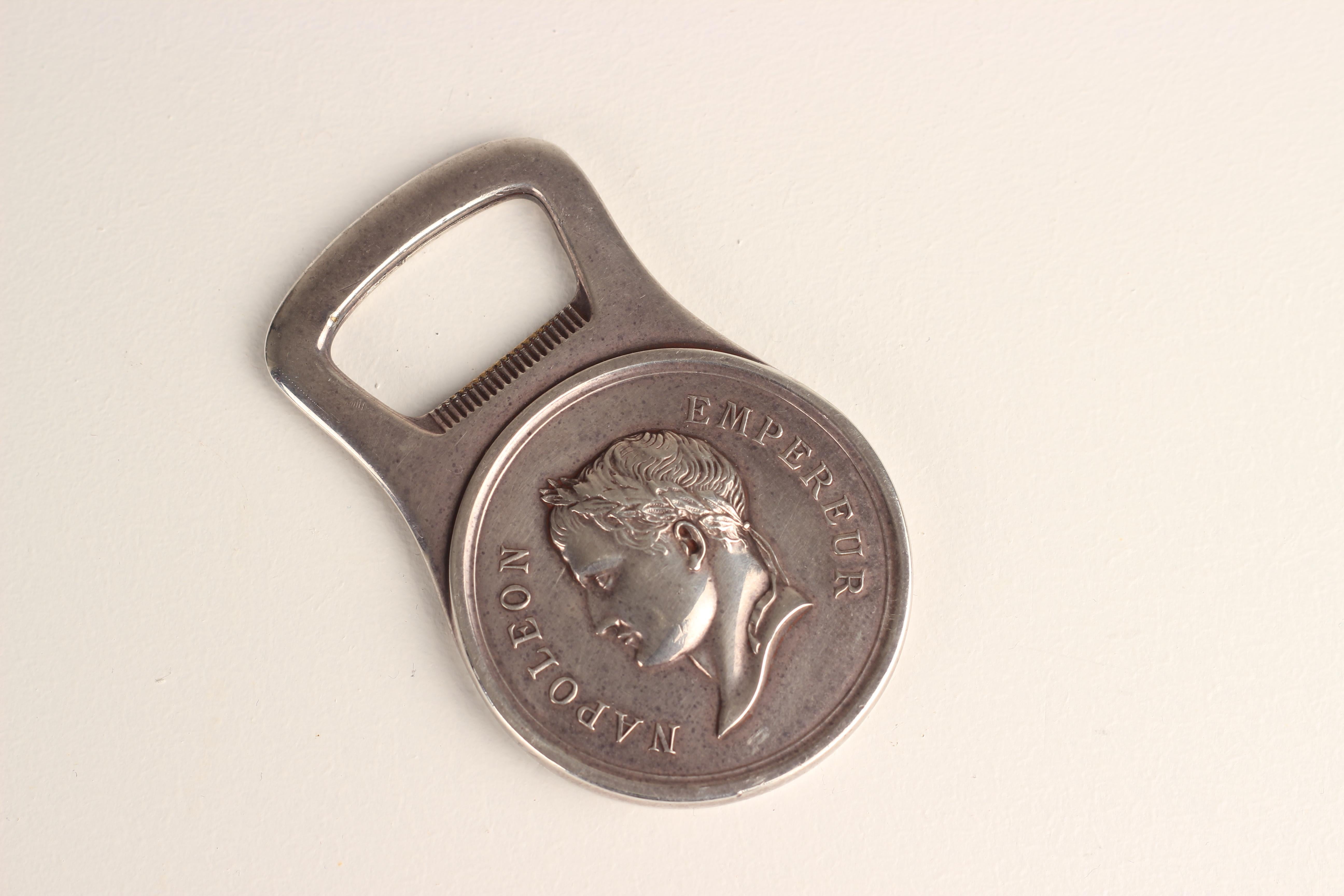 Silverplated bottle opener by Christfole, Gallia collection, representing a medal with the French Emperor Napoleon in profile and the inscription 